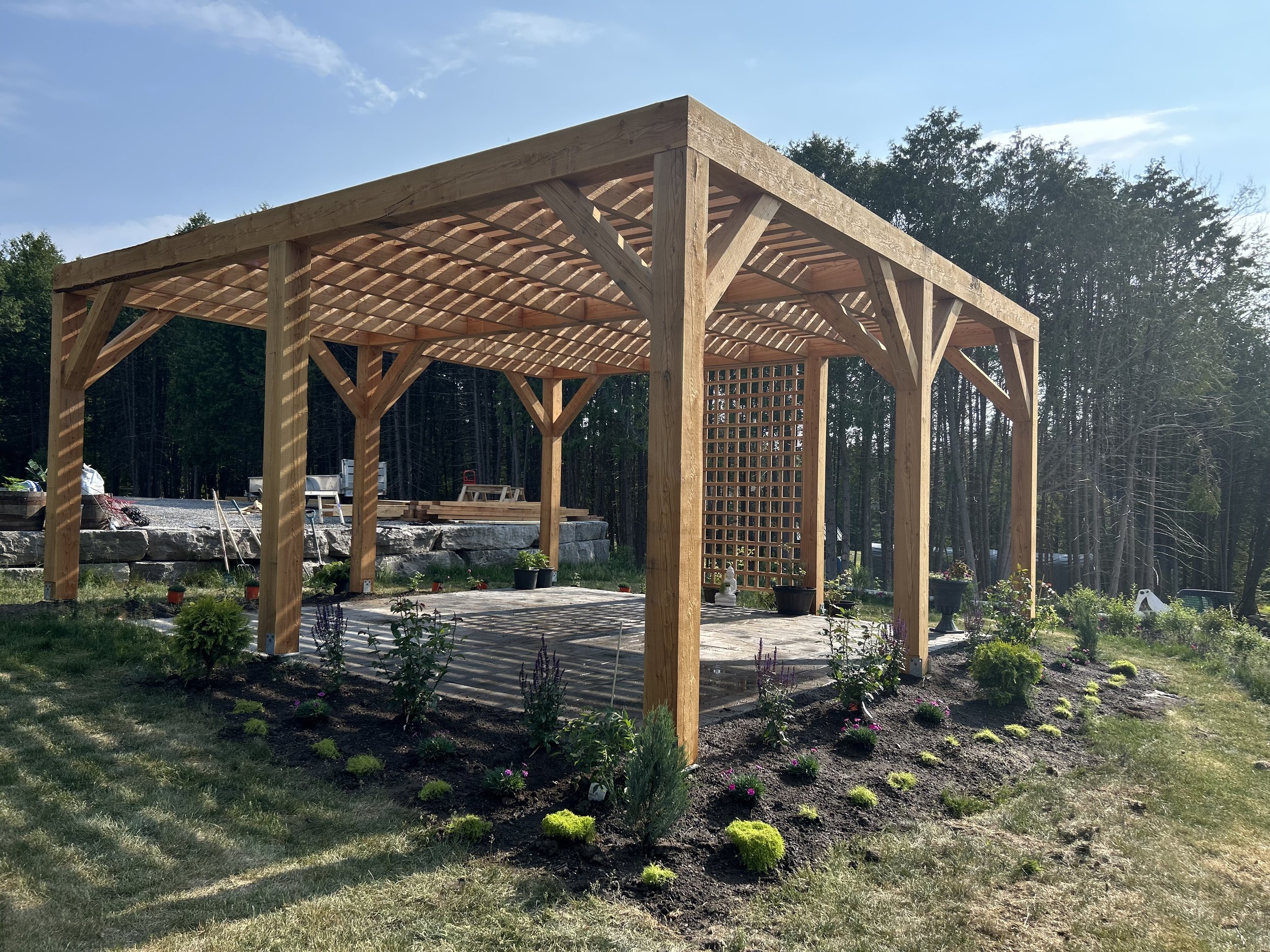 Timber pergola with interlock patio built by Mainframe Developments, cottage country Ontario