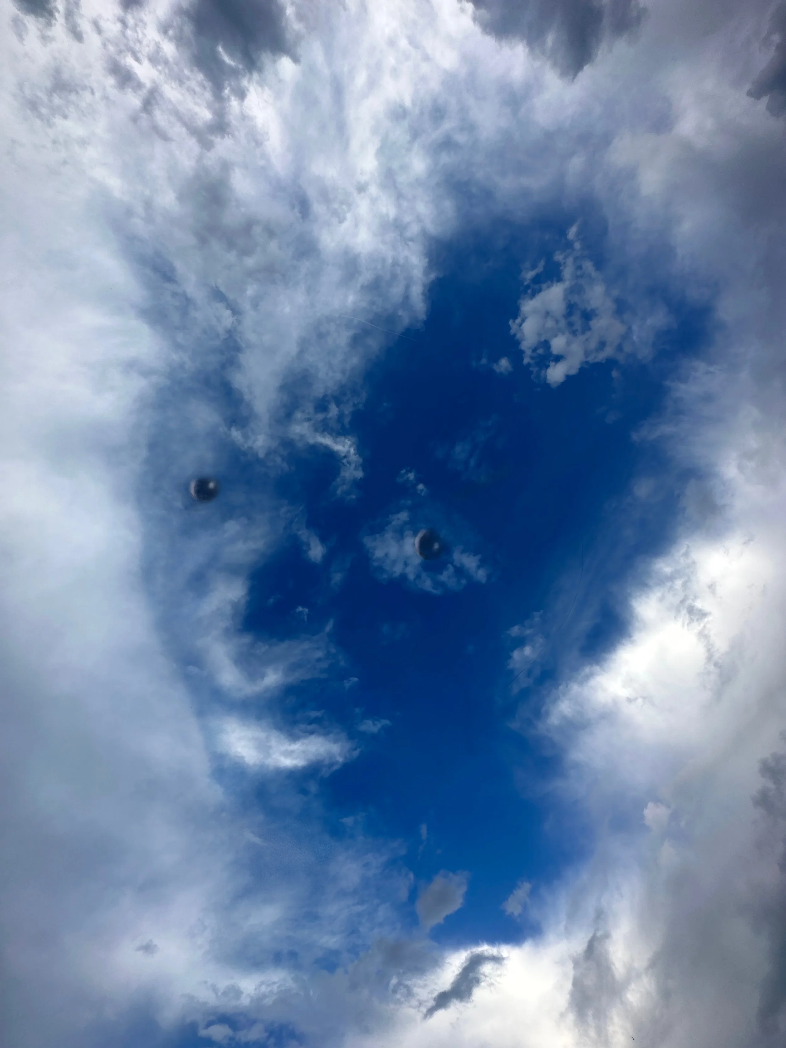 The sky is partly cloudy with a mix of white clouds and patches of blue sky.