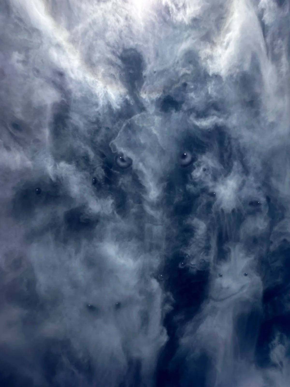 Close-up of soap bubbles and swirling foam.