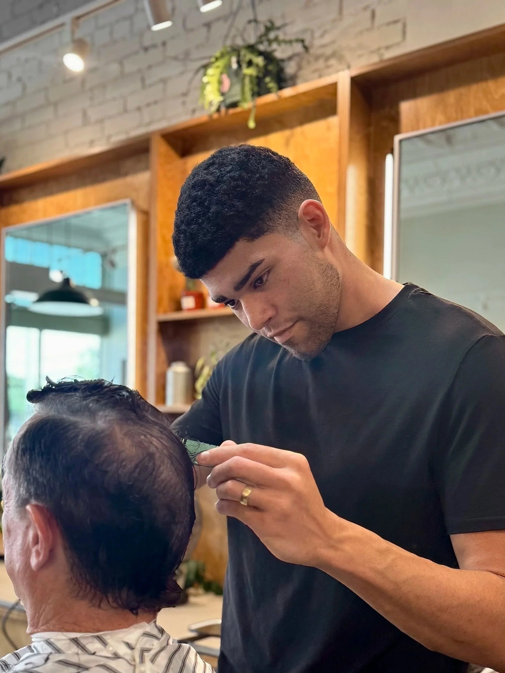 Cameron Donnelly Fort Worth Barber Shop barber cutting hair