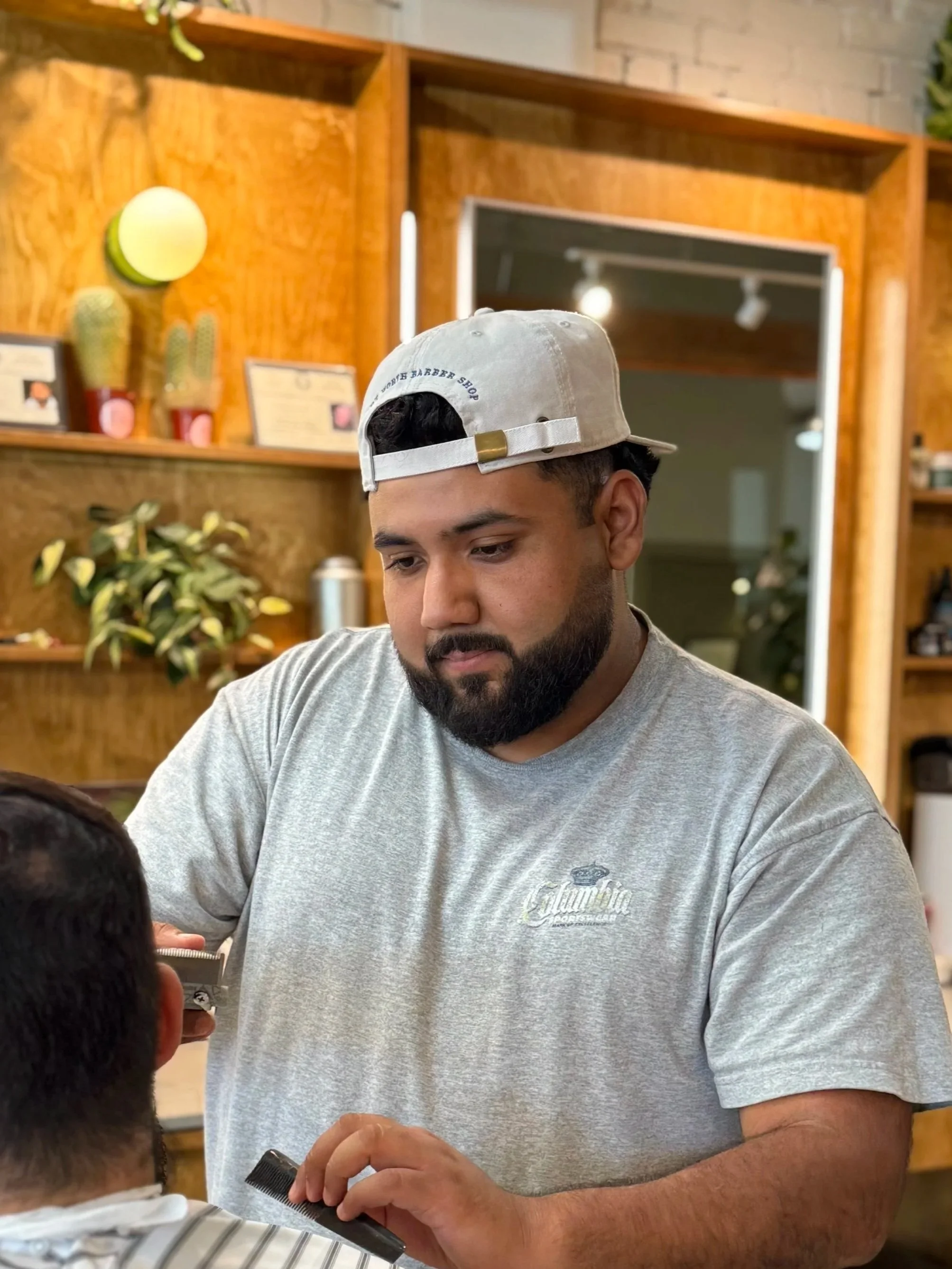 Alan Antunez Fort Worth Barber Shop barber cutting hair