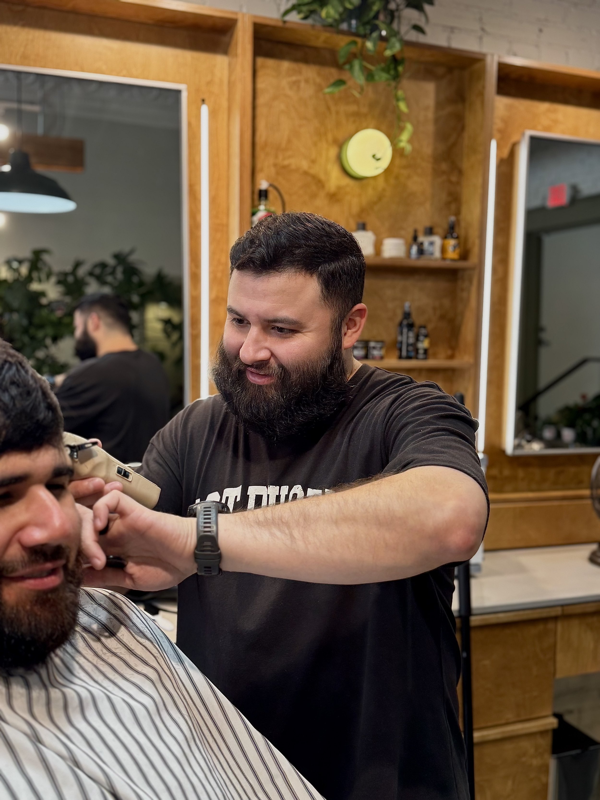 Zach Loredo Fort Worth Barber Shop barber cutting hair