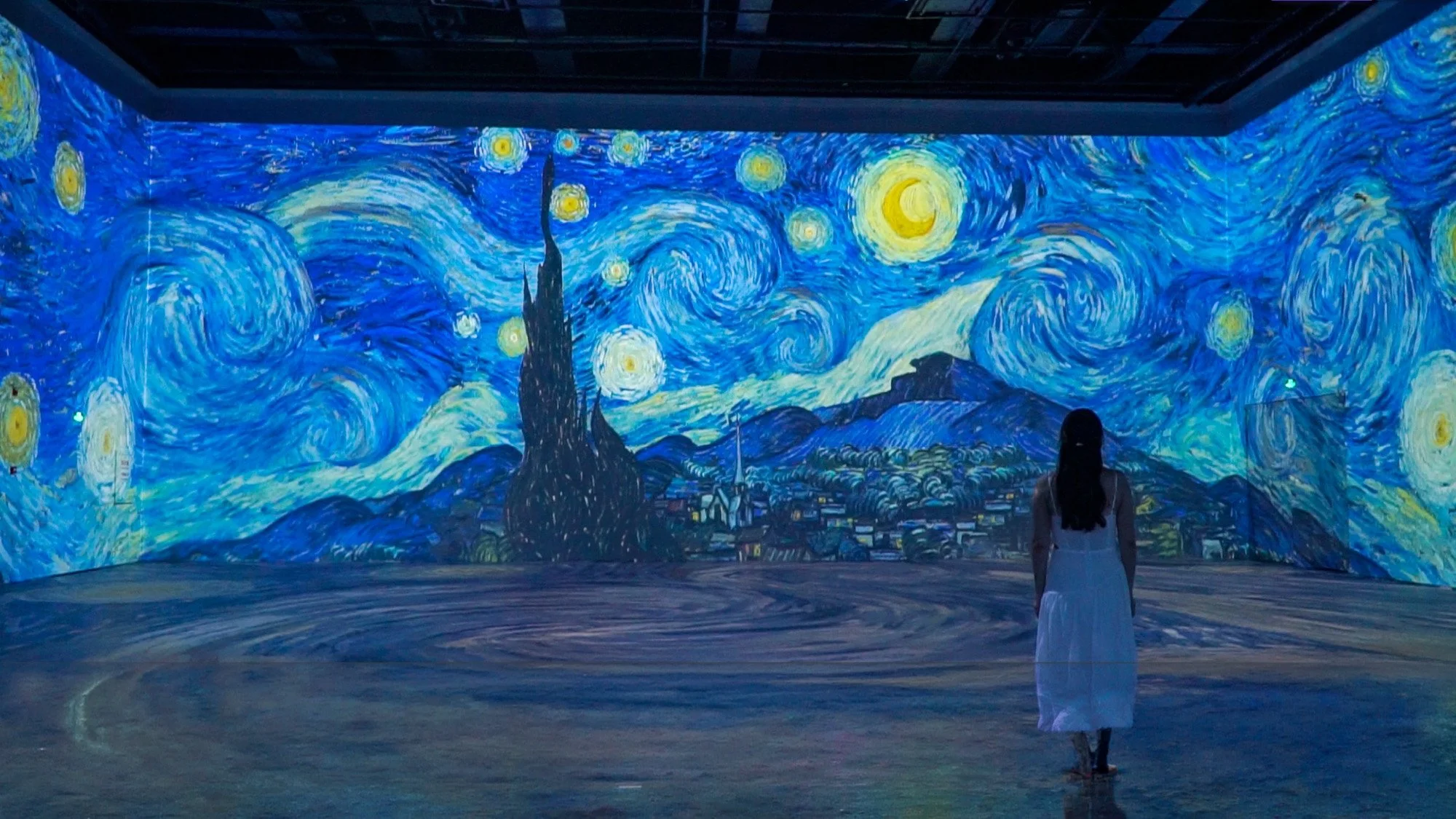 Immersive digital display of van Gogh's "Starry Night" at Plus Art Exhibition Center in Beijing.