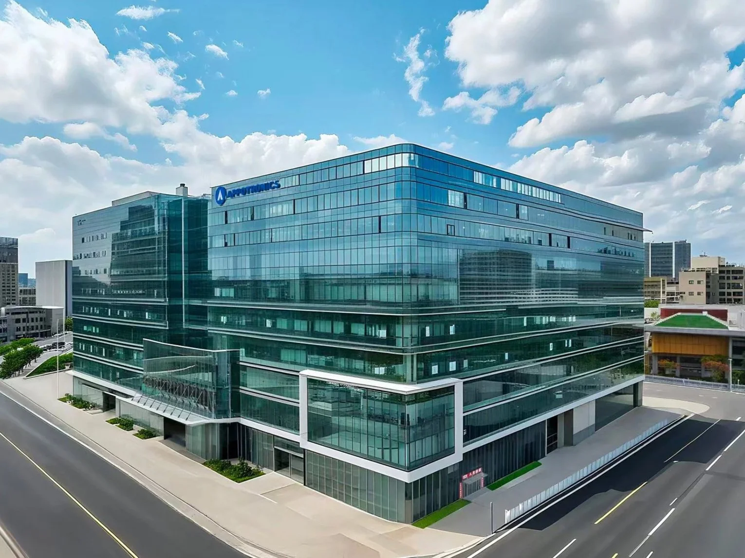 Modern glass office building with the AutoHungs logo on the upper corner, adjacent streets, and a partly cloudy sky.
