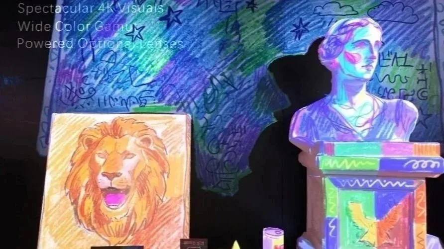Ai Mapper projecting vibrant fluorescent artwork onto a lion image and European bust sculpture.