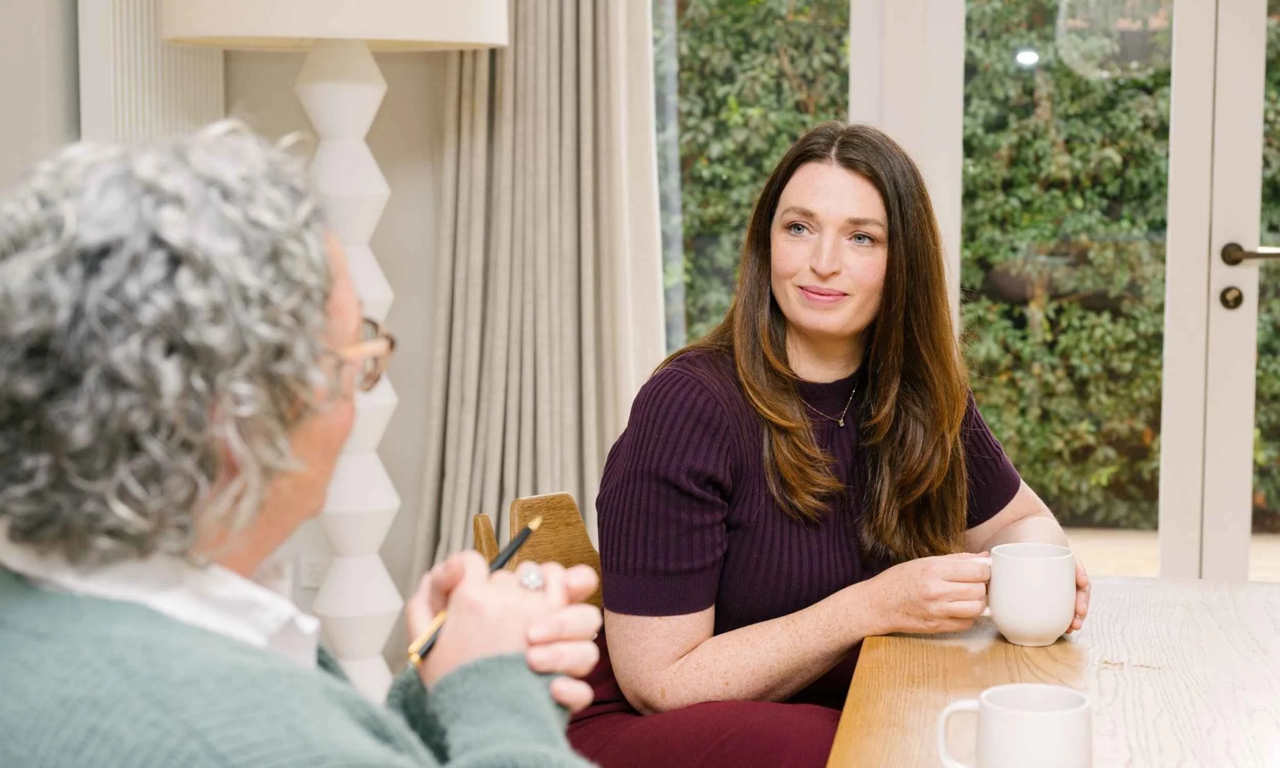 Hannah from Small Circle having a career advice conversation with a client in a relaxed professional setting.