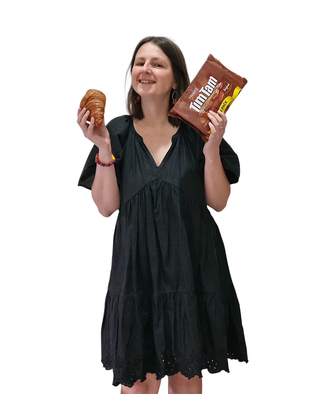 Sophie, Melbourne French tutor, smiling and holding a croissant in one hand and a packet of Tim Tams in the other — where French meets Australian