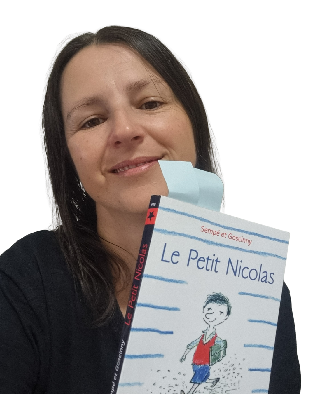 Sophie, founder of Sophie French Tutor, smiling and holding a copy of Le Petit Nicolas by Sempé and Goscinny — French book club for adults in Melbourne