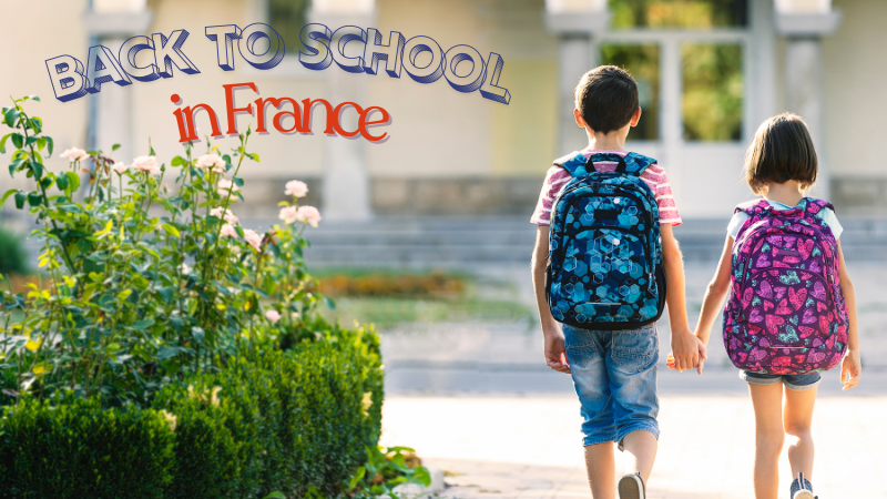 Two children with backpacks hold hands, walking towards a school. The text "Back to School in France" is visible. Bright and cheerful setting.