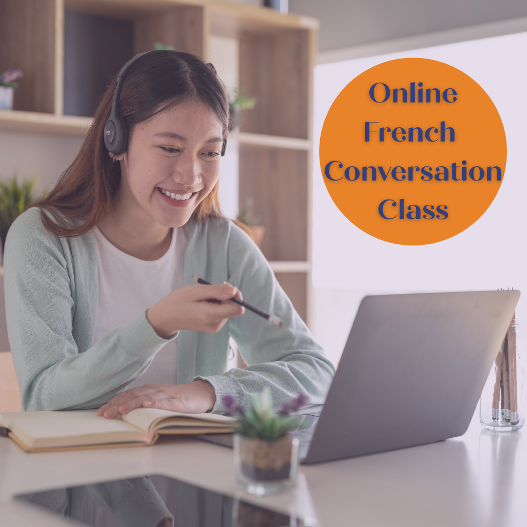 Woman smiling and taking notes during an online French conversation class, wearing headphones in front of a laptop