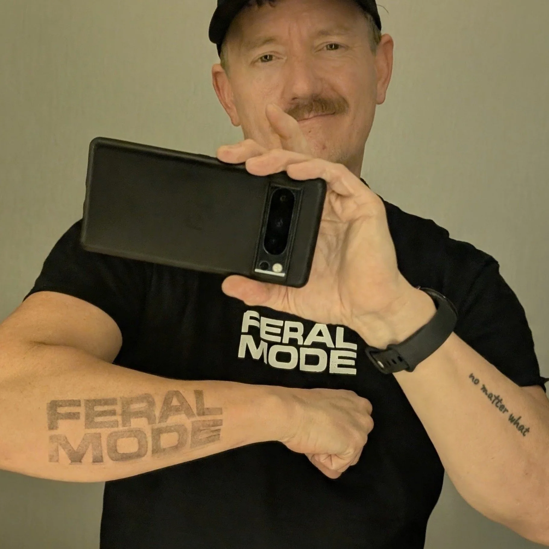 An mirror-based selfie image of the founder, Jason holding his phone