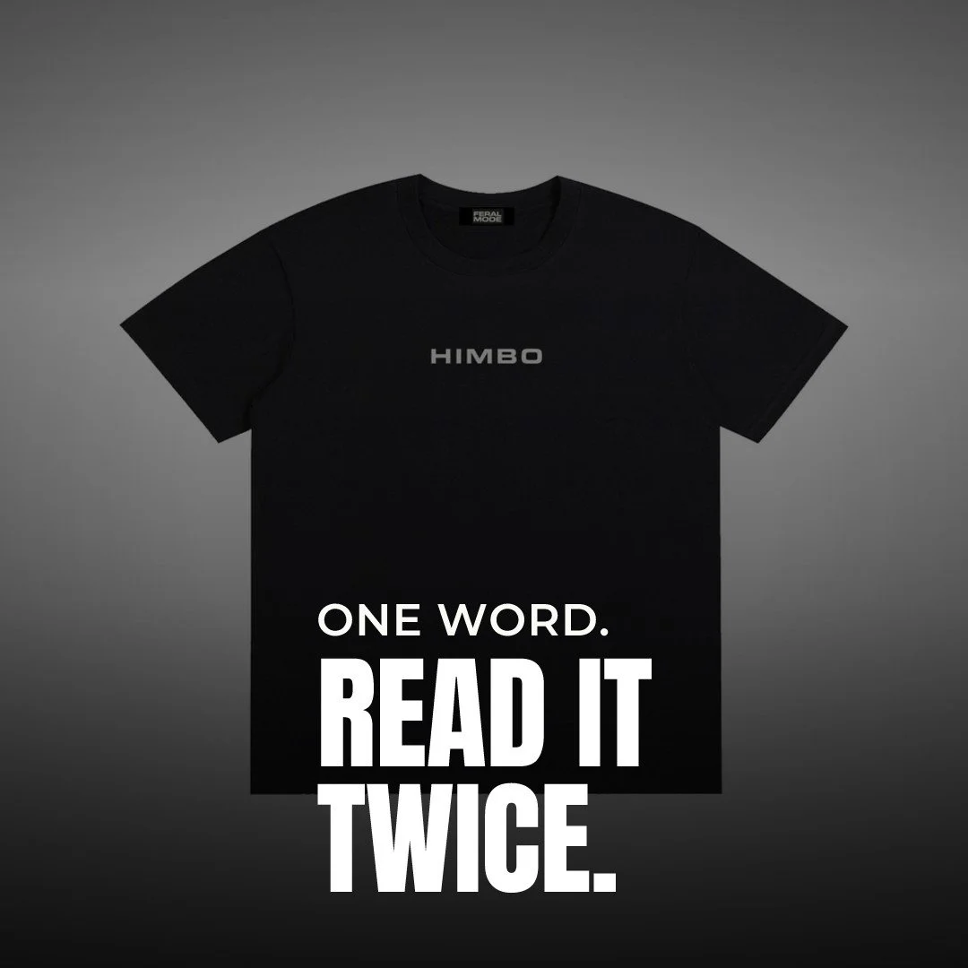 You have to look twice.

HIMBO across the chest, clean white lettering on black.

No graphics fighting for space. No slogan yelling at you.

Just one word that makes people slow their scroll and read it again.

That's the whole point. It earns the lo