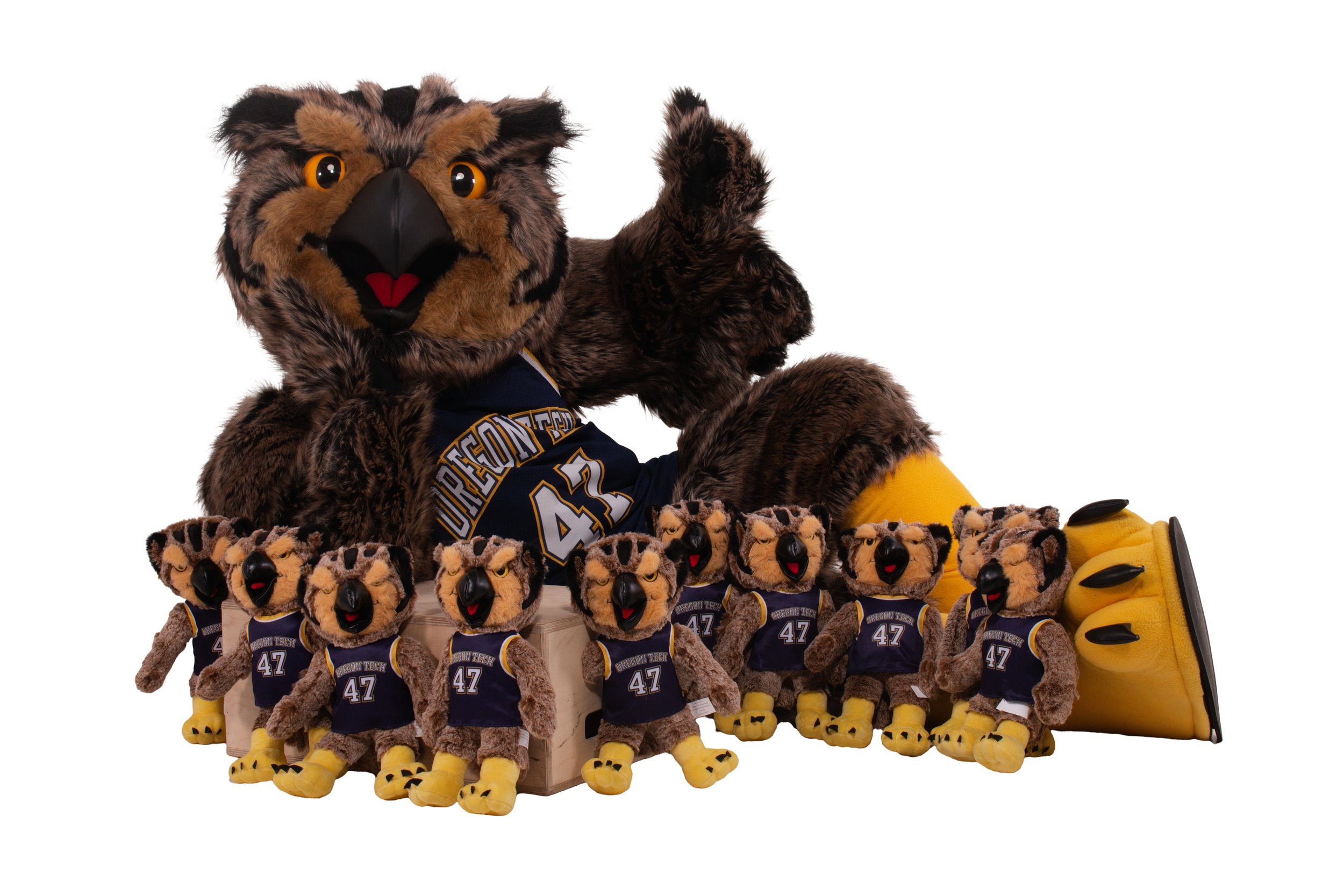 Hootie & his minions, a flock of tiny Hootie plushies, surrounding him as he lies on his side and gives a thumbs-up.
