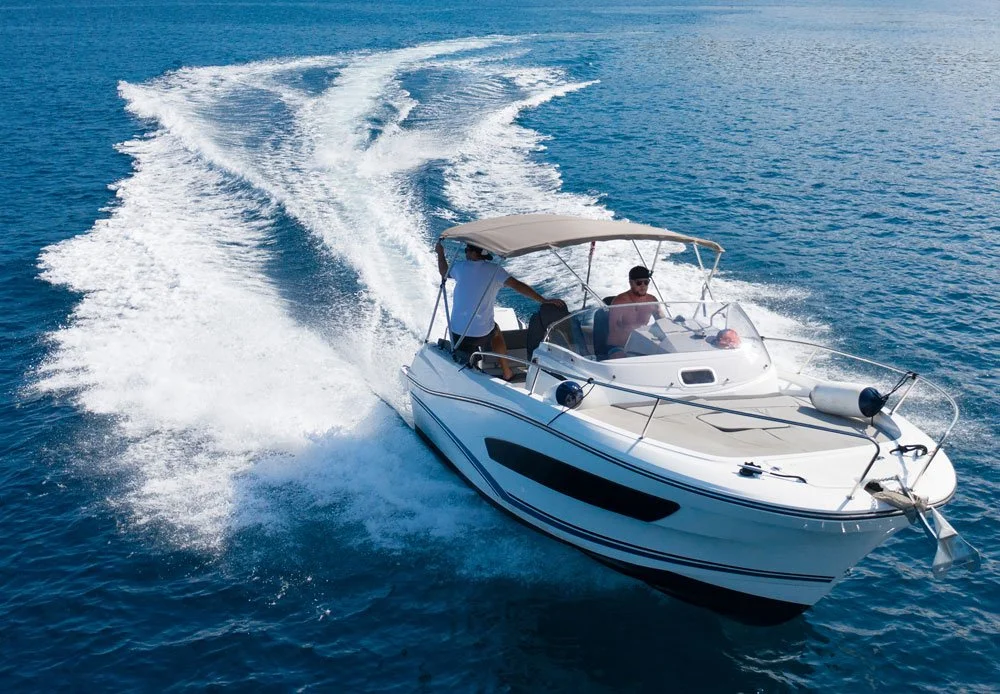 man in speedboat on open ocean