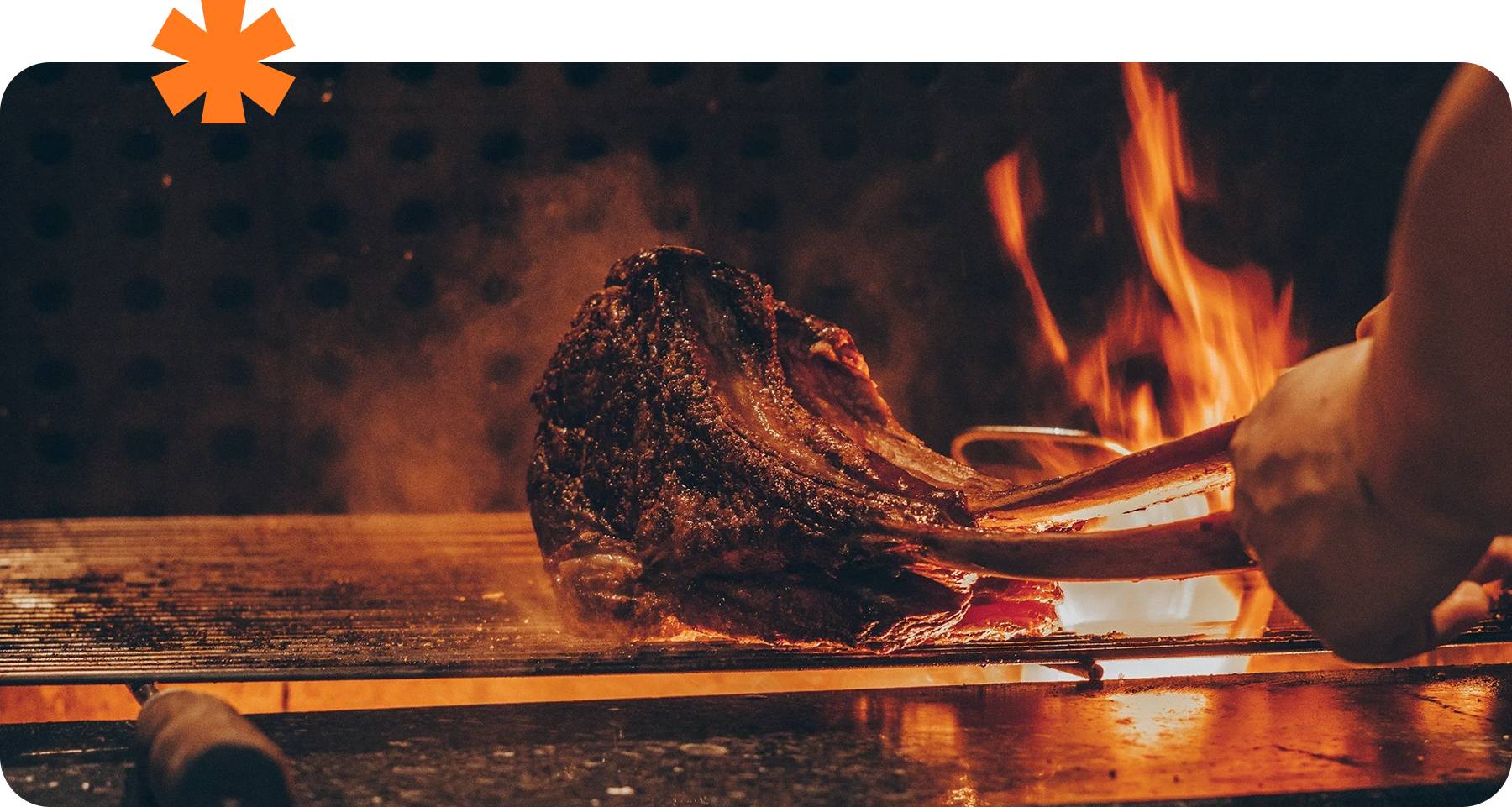 Chef grilling premium steak over open flame in Melbourne hospitality restaurant kitchen during service