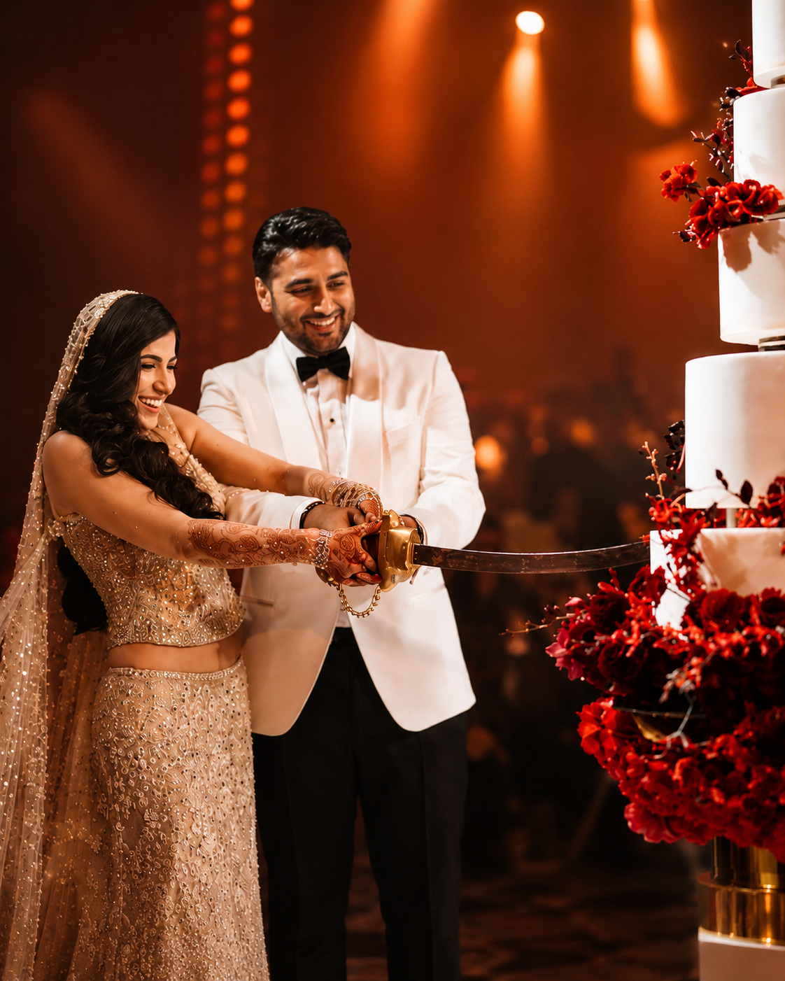 Bride and groom cutting their bespoke floating wedding cake together at an elegant celebration.