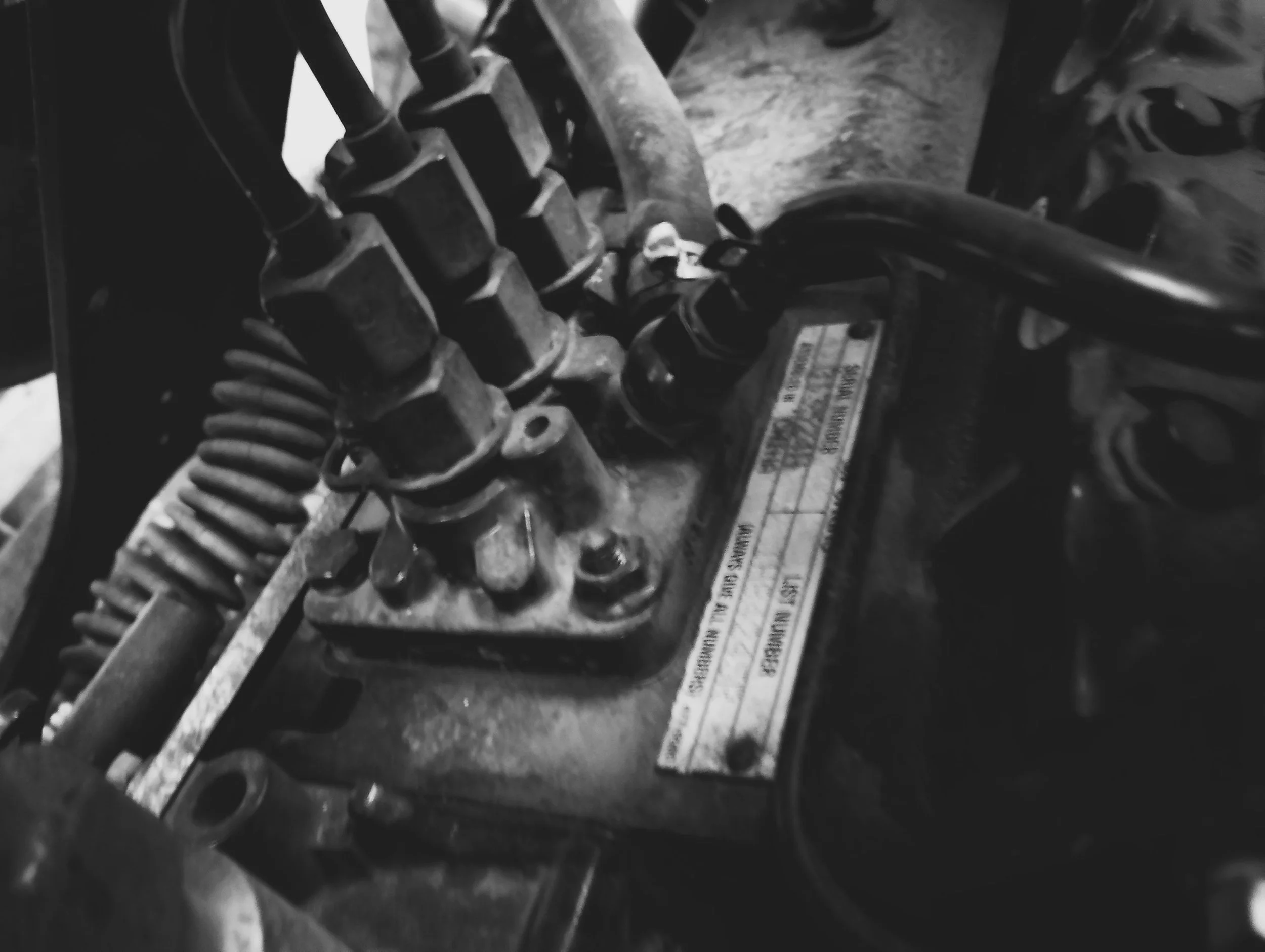 Close-up of a motorcycle engine with visible spark plug wires
