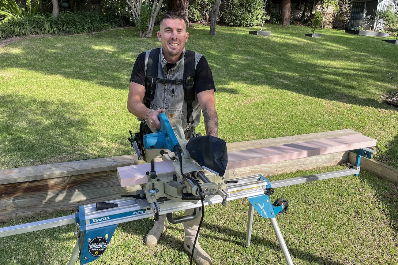 Carpenter using bench saw