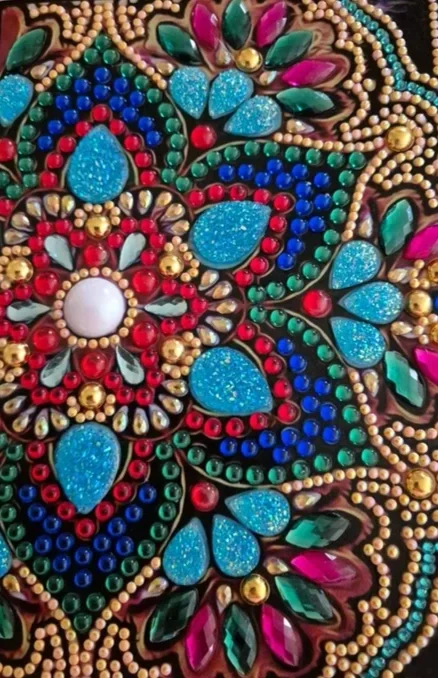 Close-up of colorful, intricate diamond art mandala