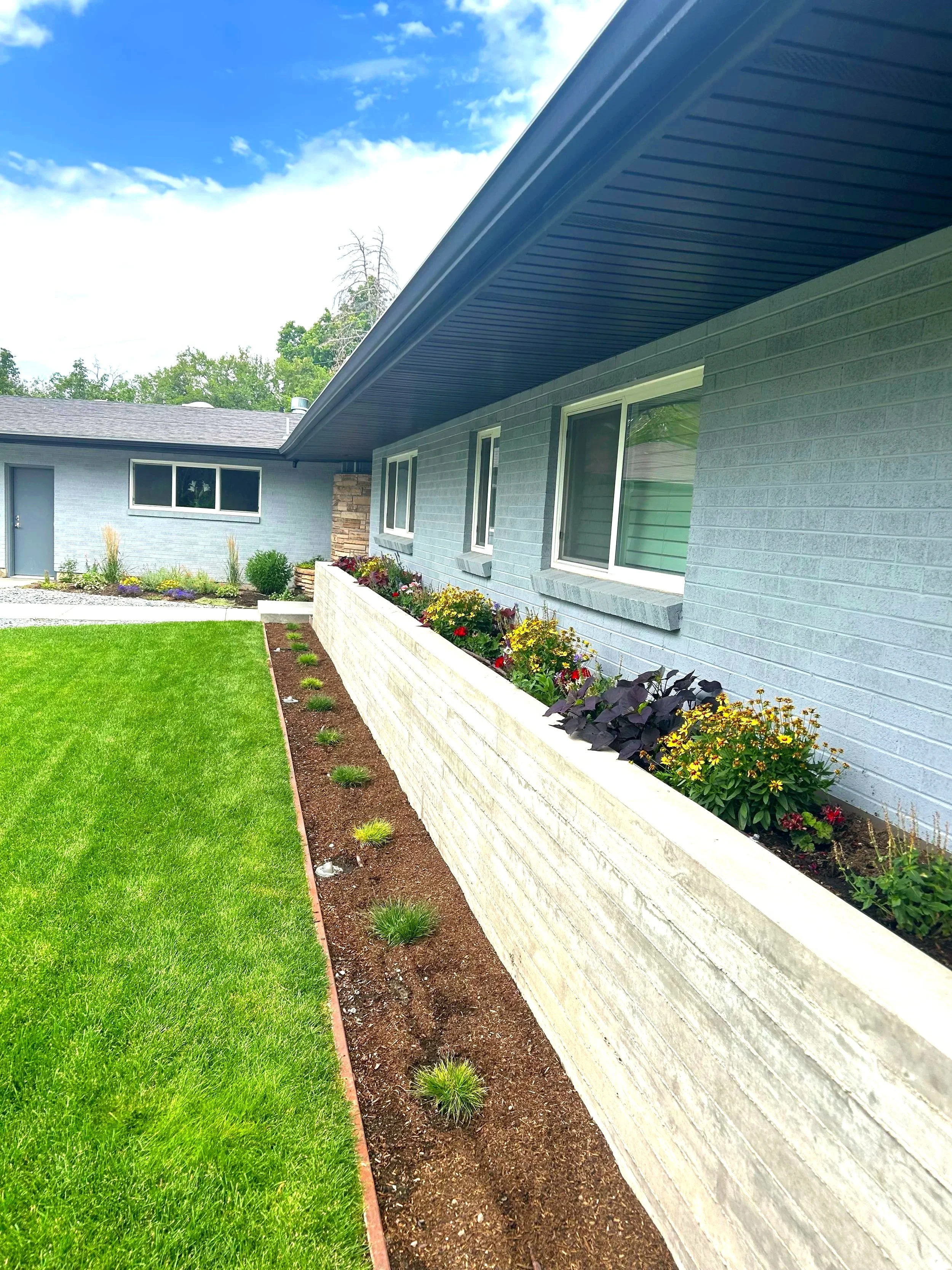 Custom planter design and installation service in East Salt Lake, by L and B Landscaping. Beautiful, eye catching planters to elevate your outdoor space.