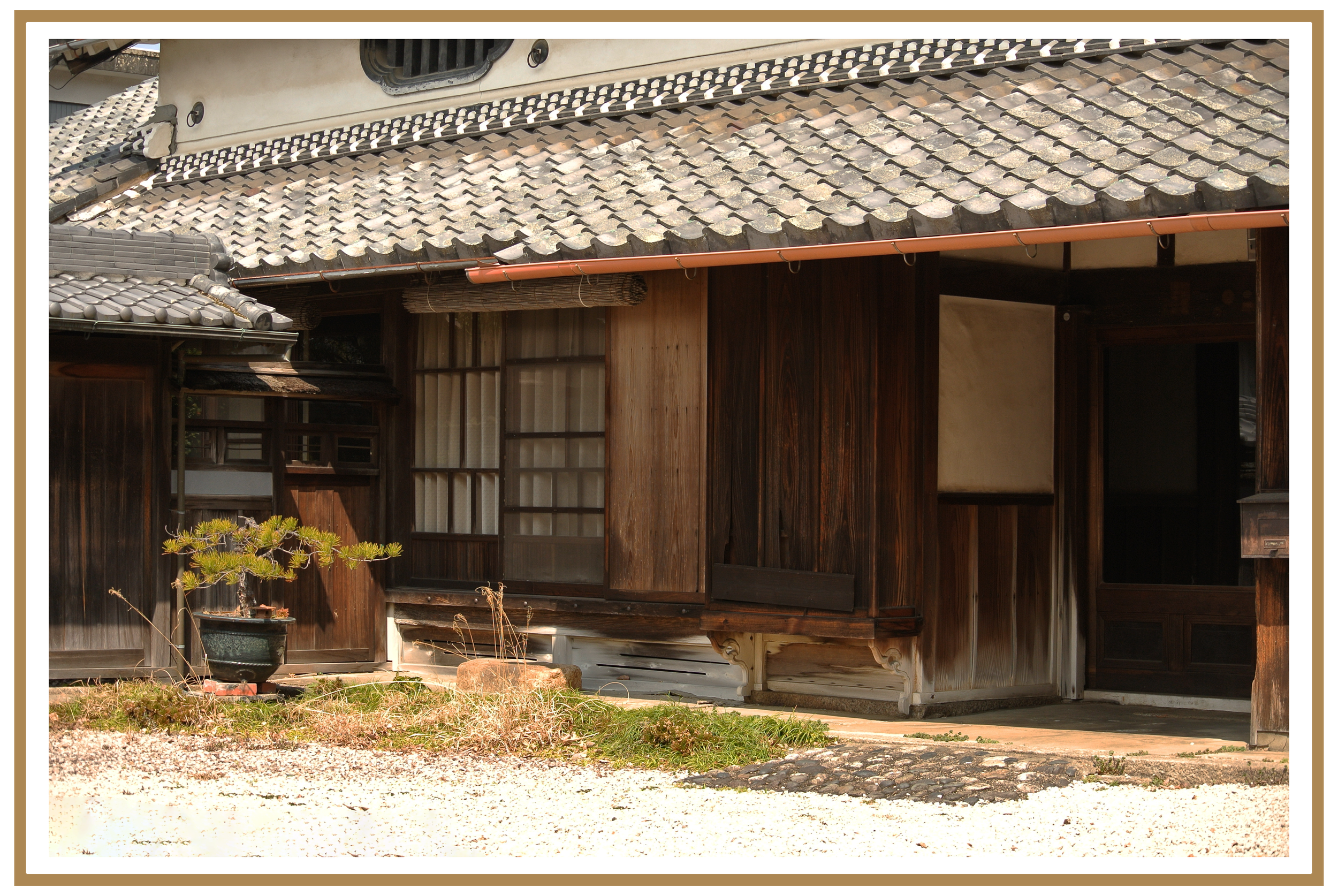 Traditional Japanese-style building with wooden sliding doors and a tiled roof.
