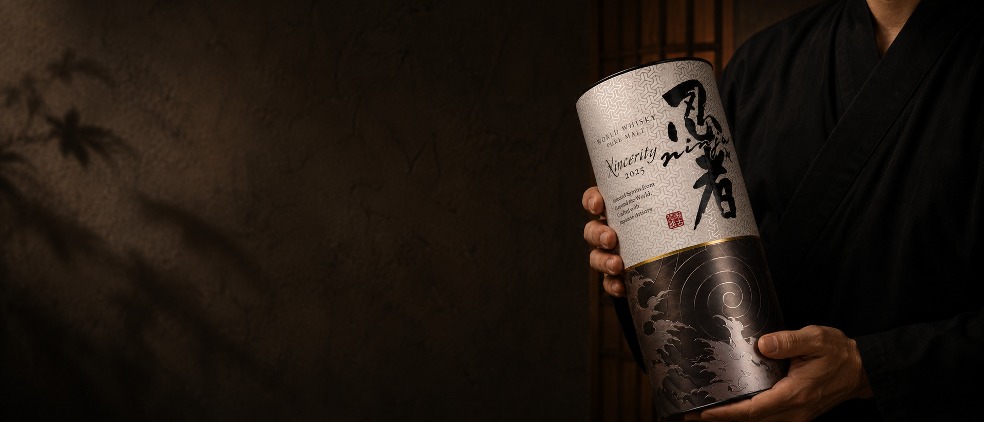 A person holds a Ninja 2025 Pure Malt World Whisky.