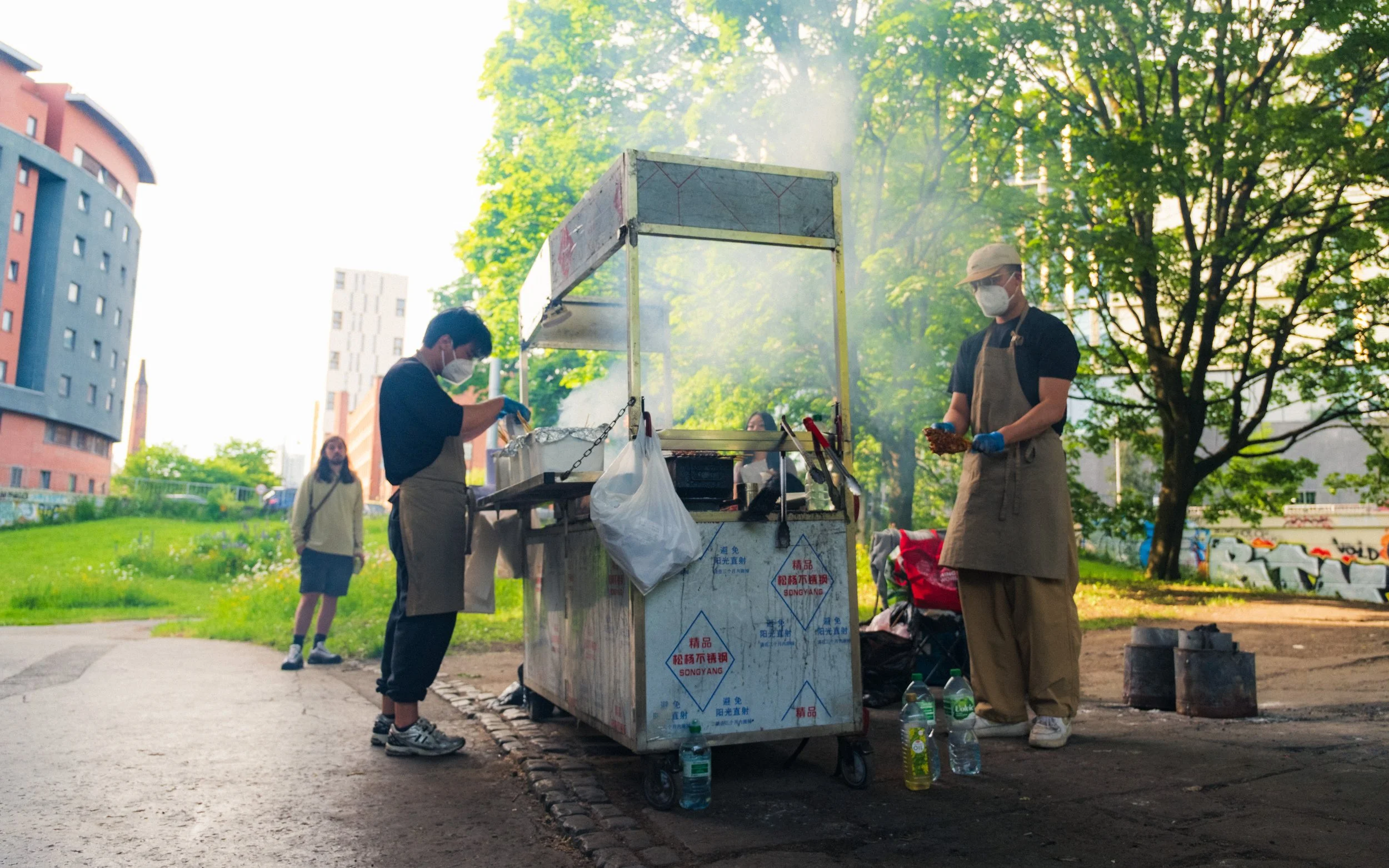 Smoke escapes from a Chinese barbeque stand beneath the Mancunian way