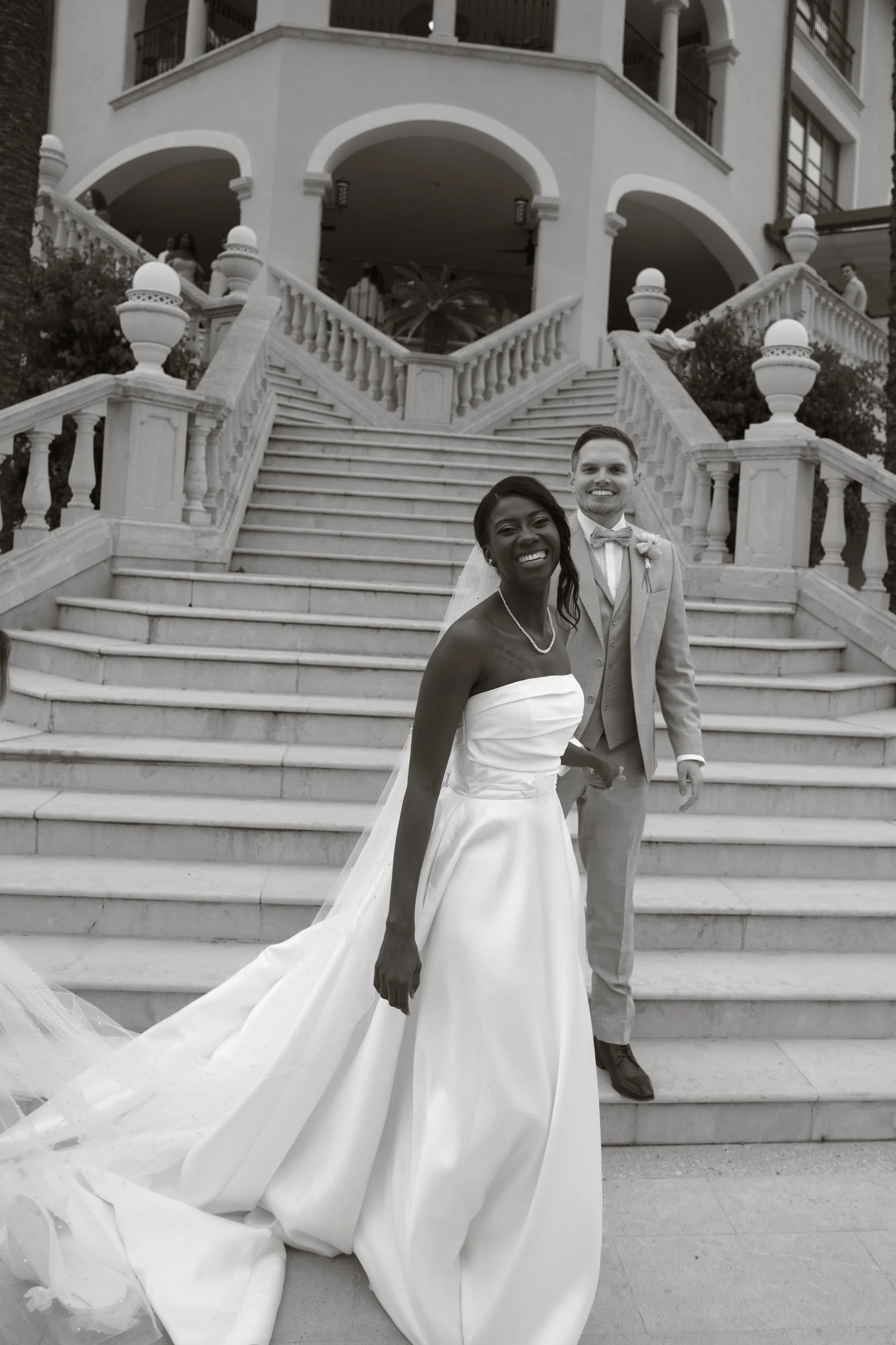 Bride on stairs with arch - wedding ceremony photography Mallorca