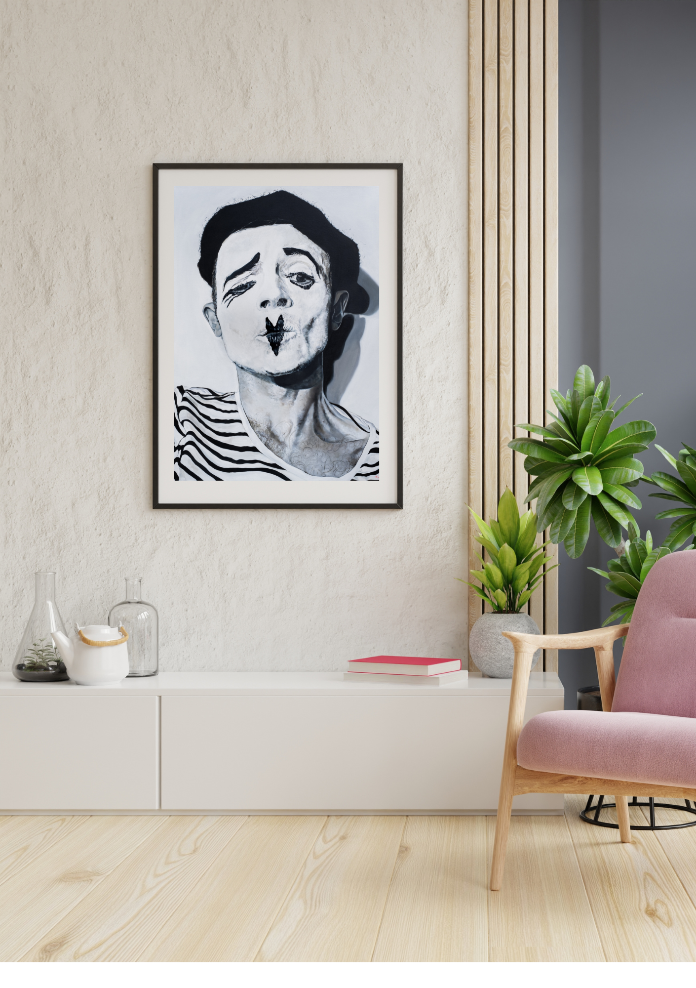 A modern living room corner featuring a framed black and white portrait of a woman making a kissy face, a white sideboard with glass cloches and a white teapot, a potted plant in a round gray pot, a pink cushioned armchair with wooden arms and legs, and a gray wall with wooden slats.
