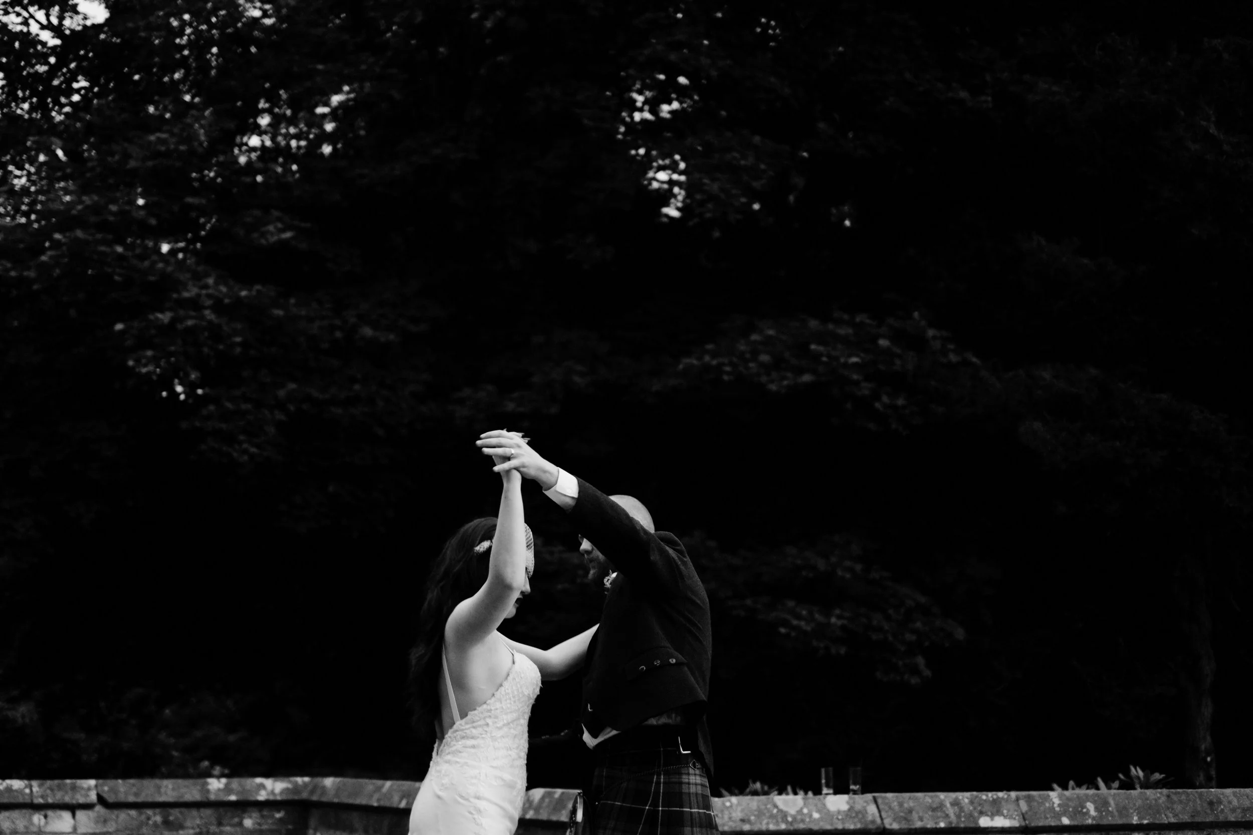 Bride and groom waltz outside