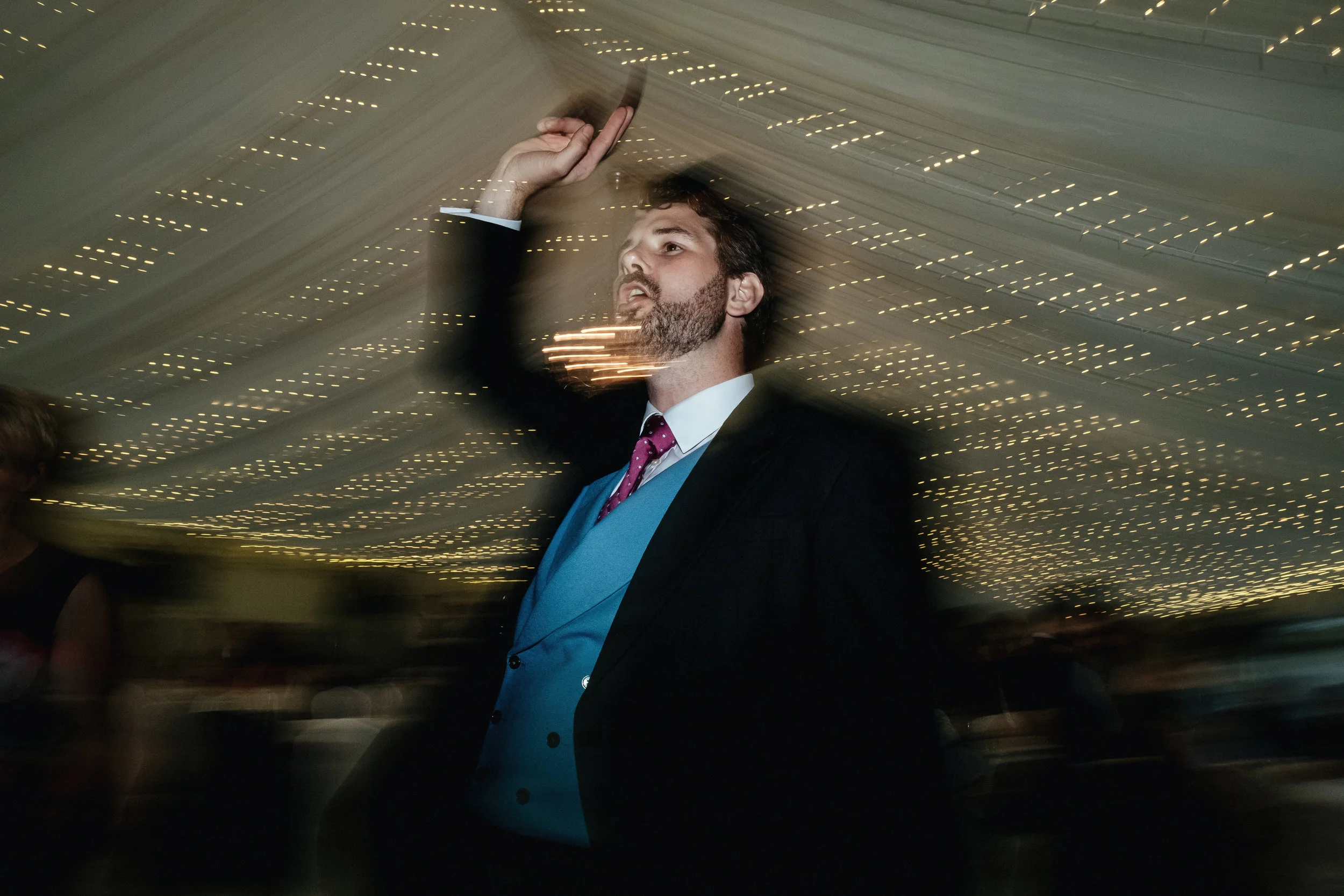 Male guest points as he dances