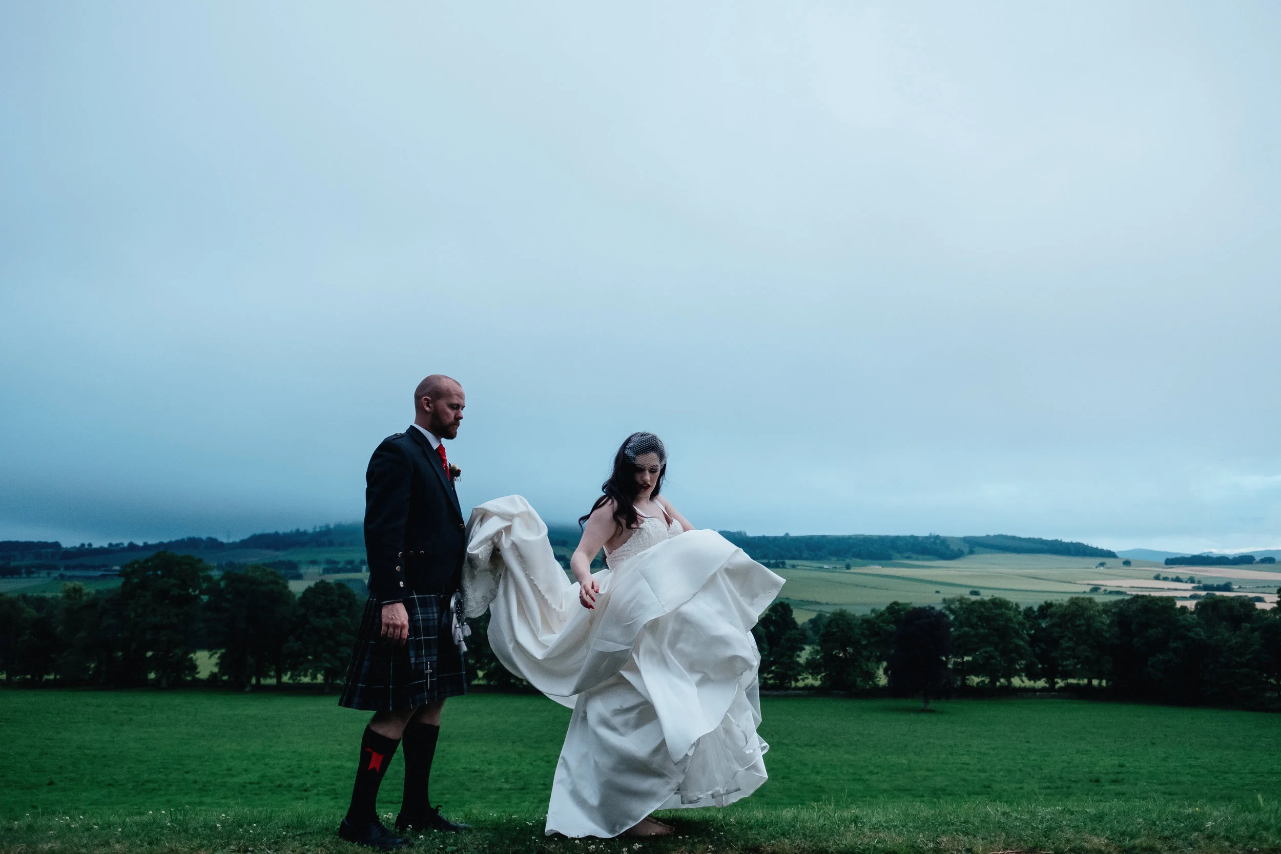 Groom and bride walk outside