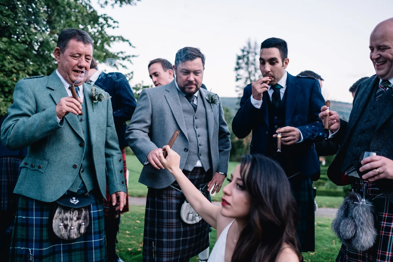  Groom takes bride's cigar from her. 