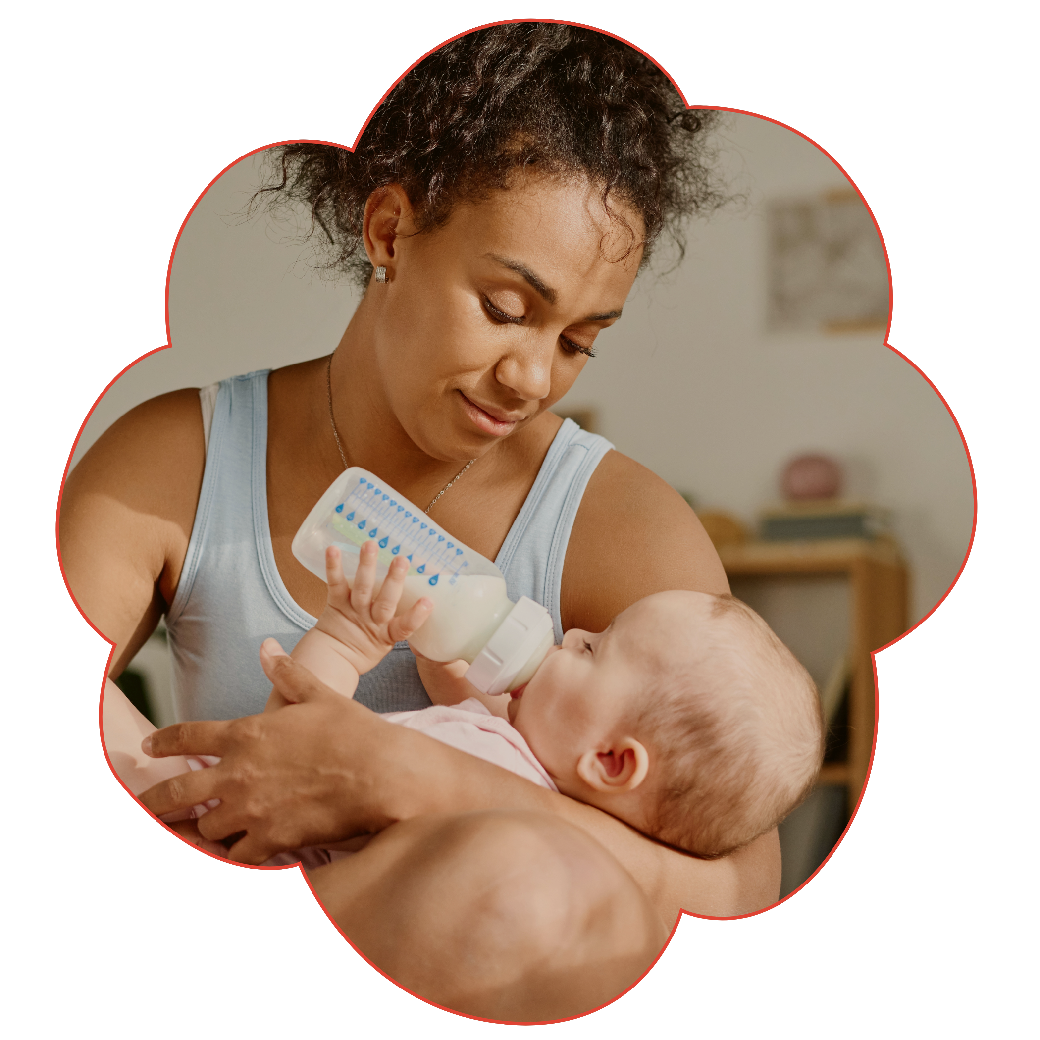 A woman with curly hair feeding a baby with a baby bottle to represent Strong Roots OT, an occupational therapy clinic in south New Jersey & Philadelphia that specializes in maternal health and pediatrics.