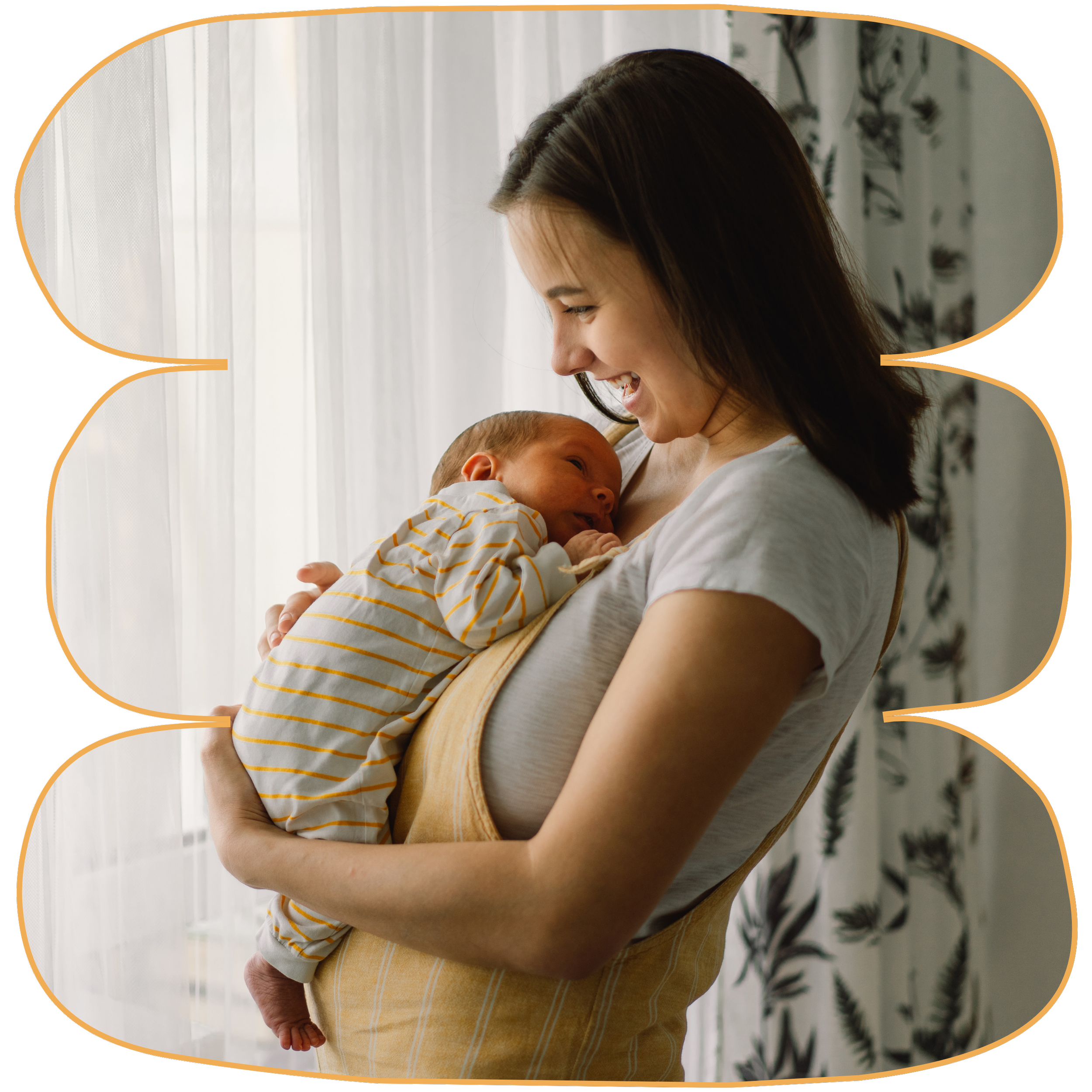 A woman with long brown hair holding a newborn. She is smiling and looking down at the baby, who appears to be happy. Strong Roots OT where we provide occupational therapy services for pediatrics and maternal health in South NJ.