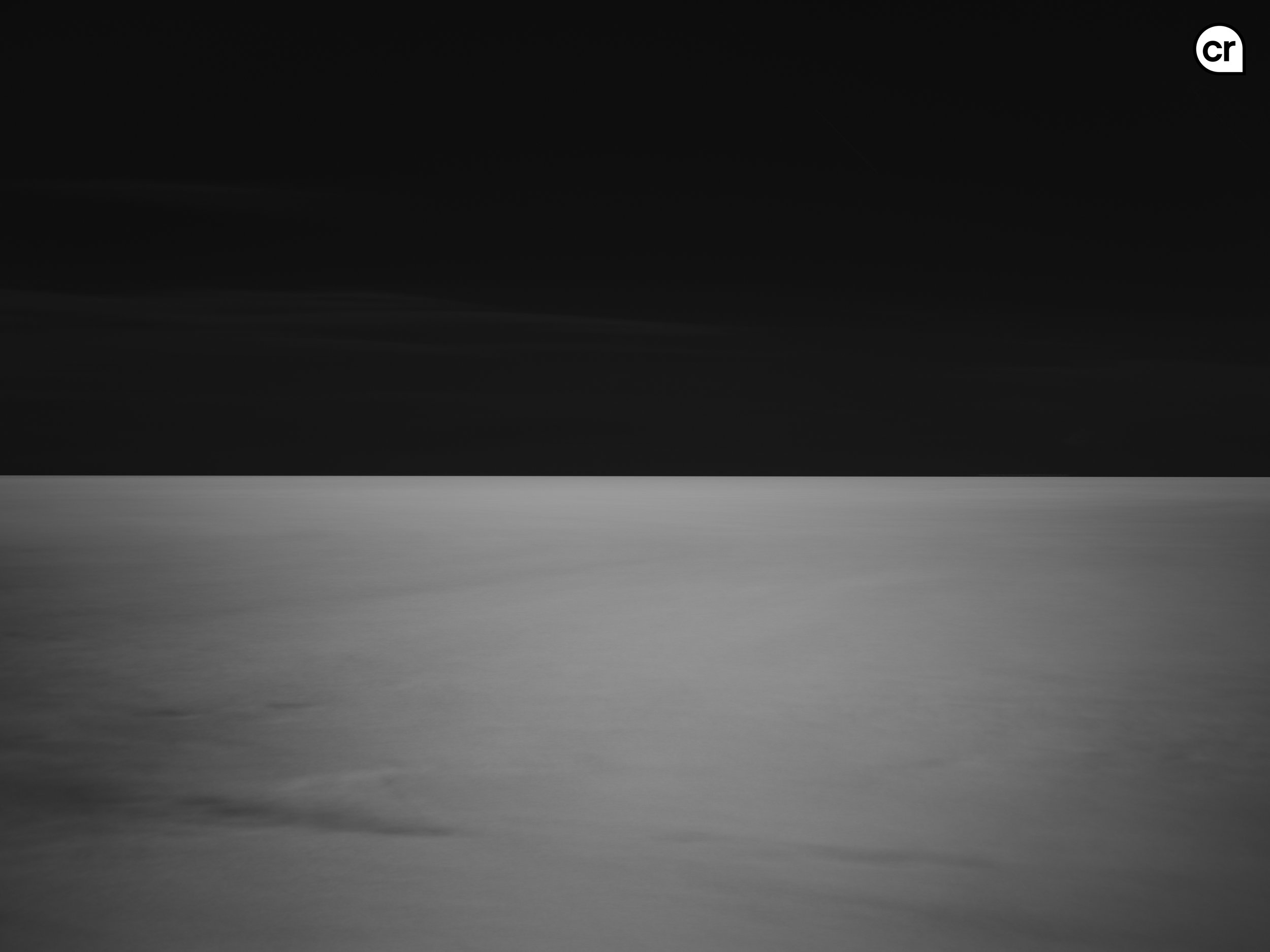 Black and white photograph of the moonlight on the Atlantic Ocean, Lisbon, Portugal. Made by Indigenous Design and Photography Ltd.