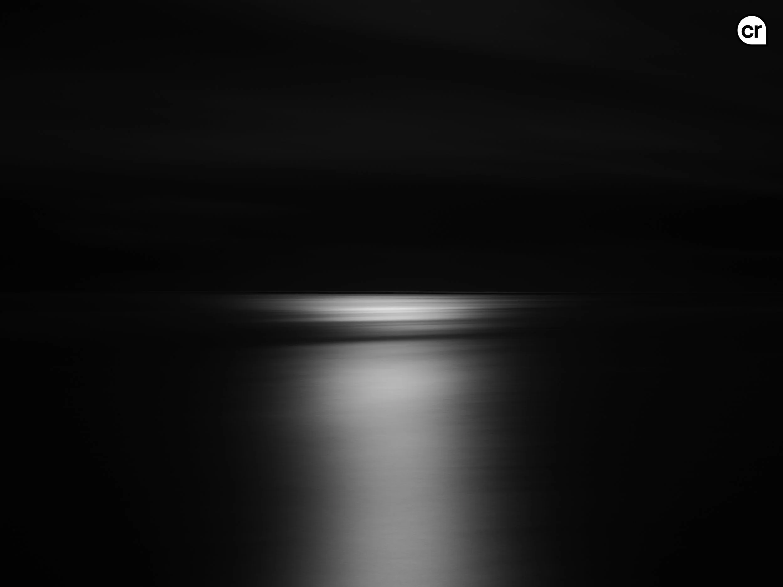 Black and white photograph of the moonlight on the Atlantic Ocean, Lisbon, Portugal. Made by Indigenous Design and Photography Ltd.