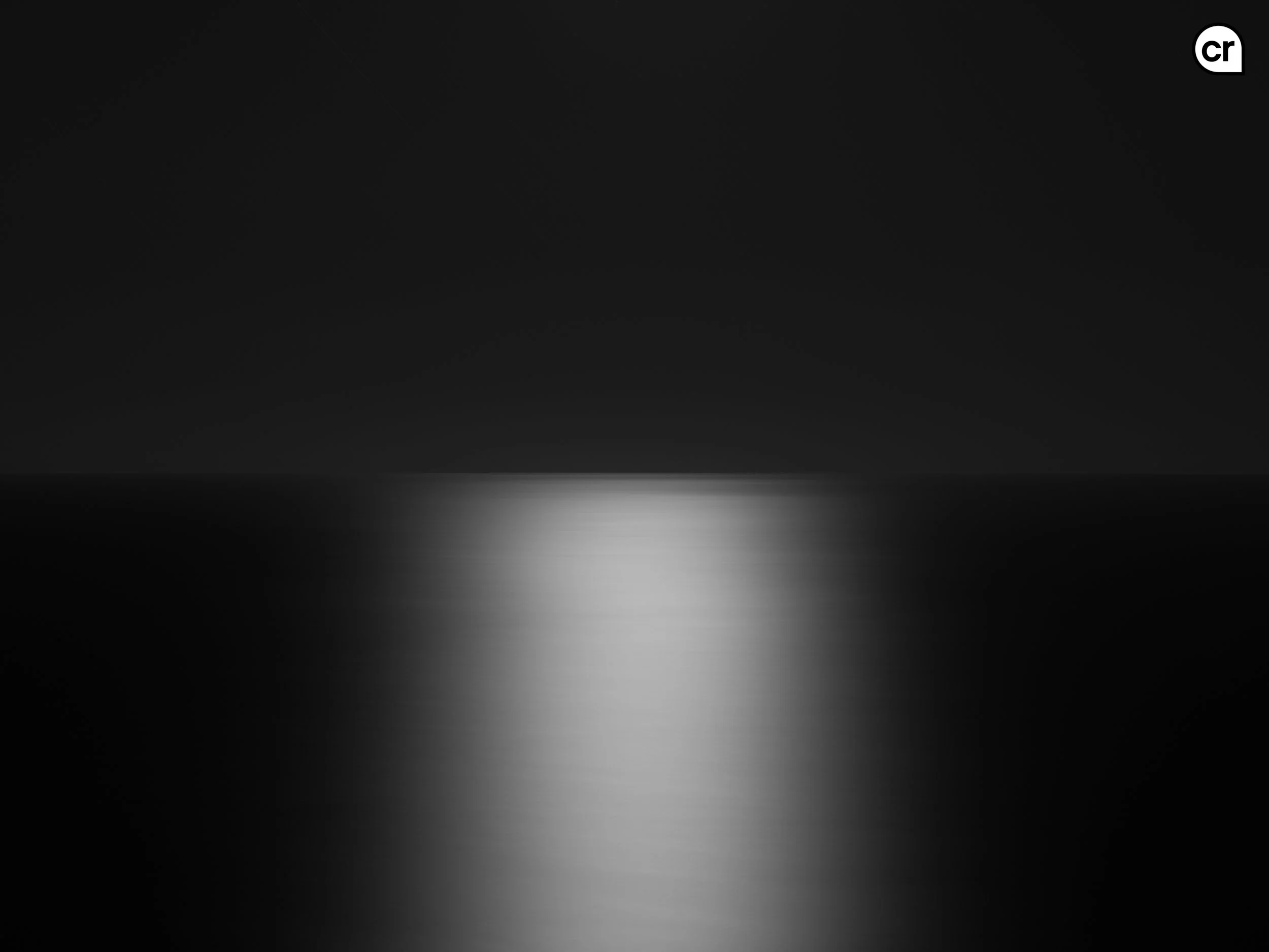 Black and white photograph of the moonlight on the Atlantic Ocean, Lisbon, Portugal. Made by Indigenous Design and Photography Ltd.