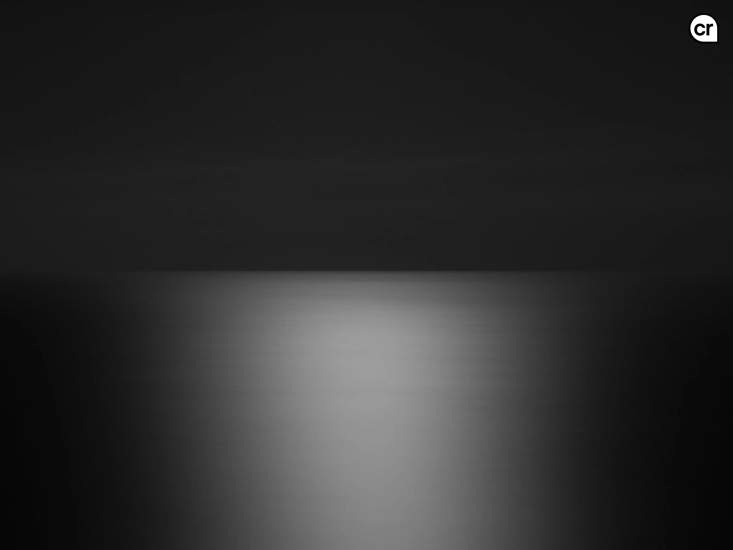 Black and white photograph of the moonlight on the Atlantic Ocean, Lisbon, Portugal. Made by Indigenous Design and Photography Ltd.