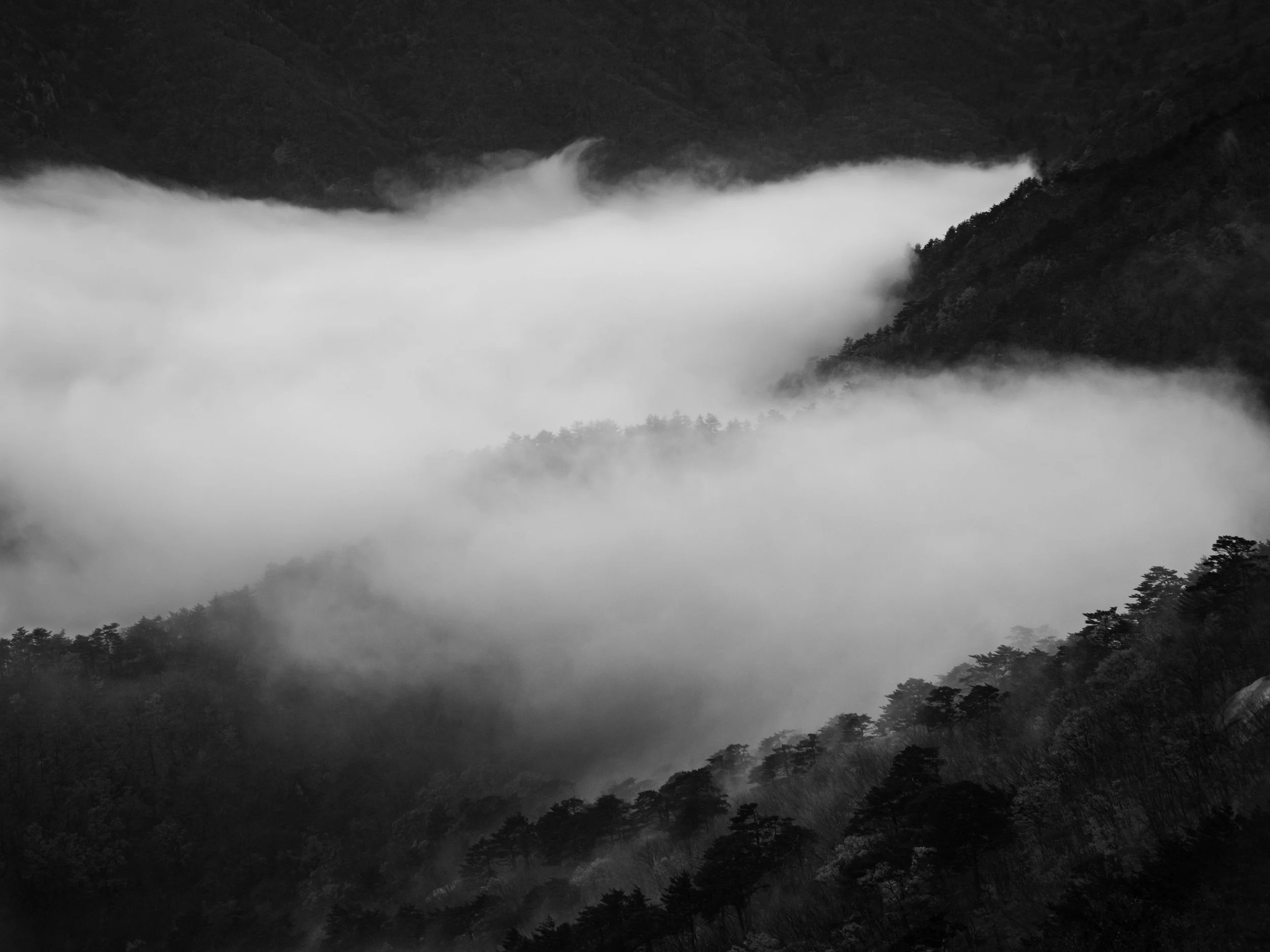 Black and white photograph of the mountains at Seoraksan, Gangwon, Korea. Made by Indigenous Design and Photography Ltd.
