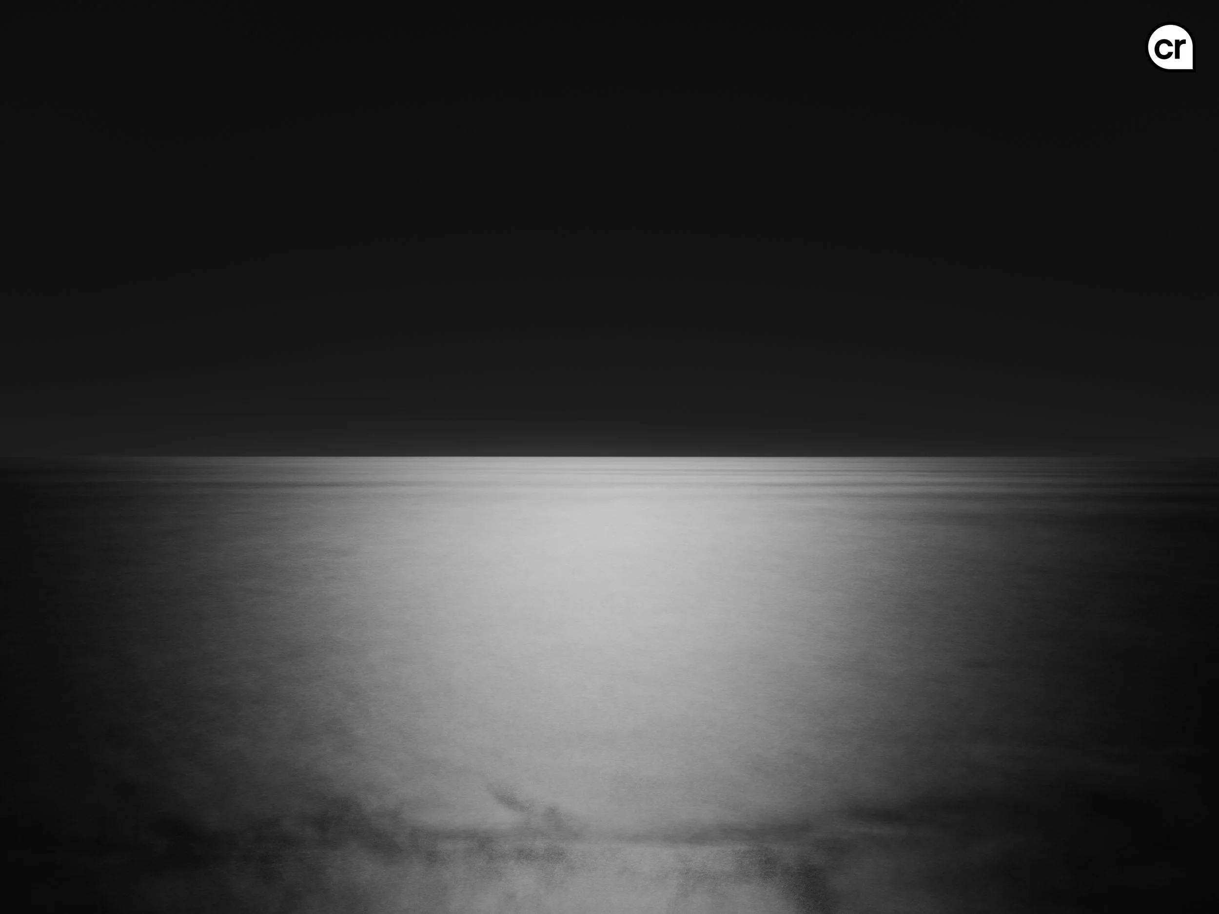 Black and white photograph of the moonlight on the Atlantic Ocean, Lisbon, Portugal. Made by Indigenous Design and Photography Ltd.