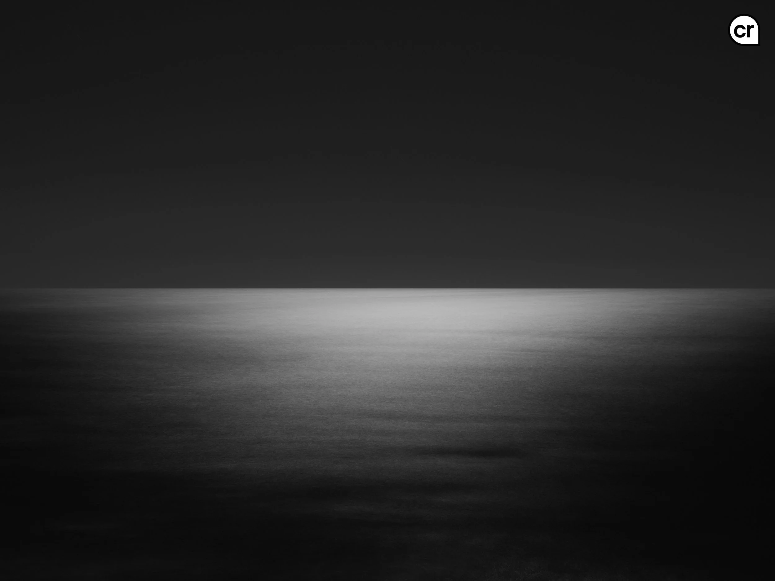 Black and white photograph of the moonlight on the Atlantic Ocean, Lisbon, Portugal. Made by Indigenous Design and Photography Ltd.