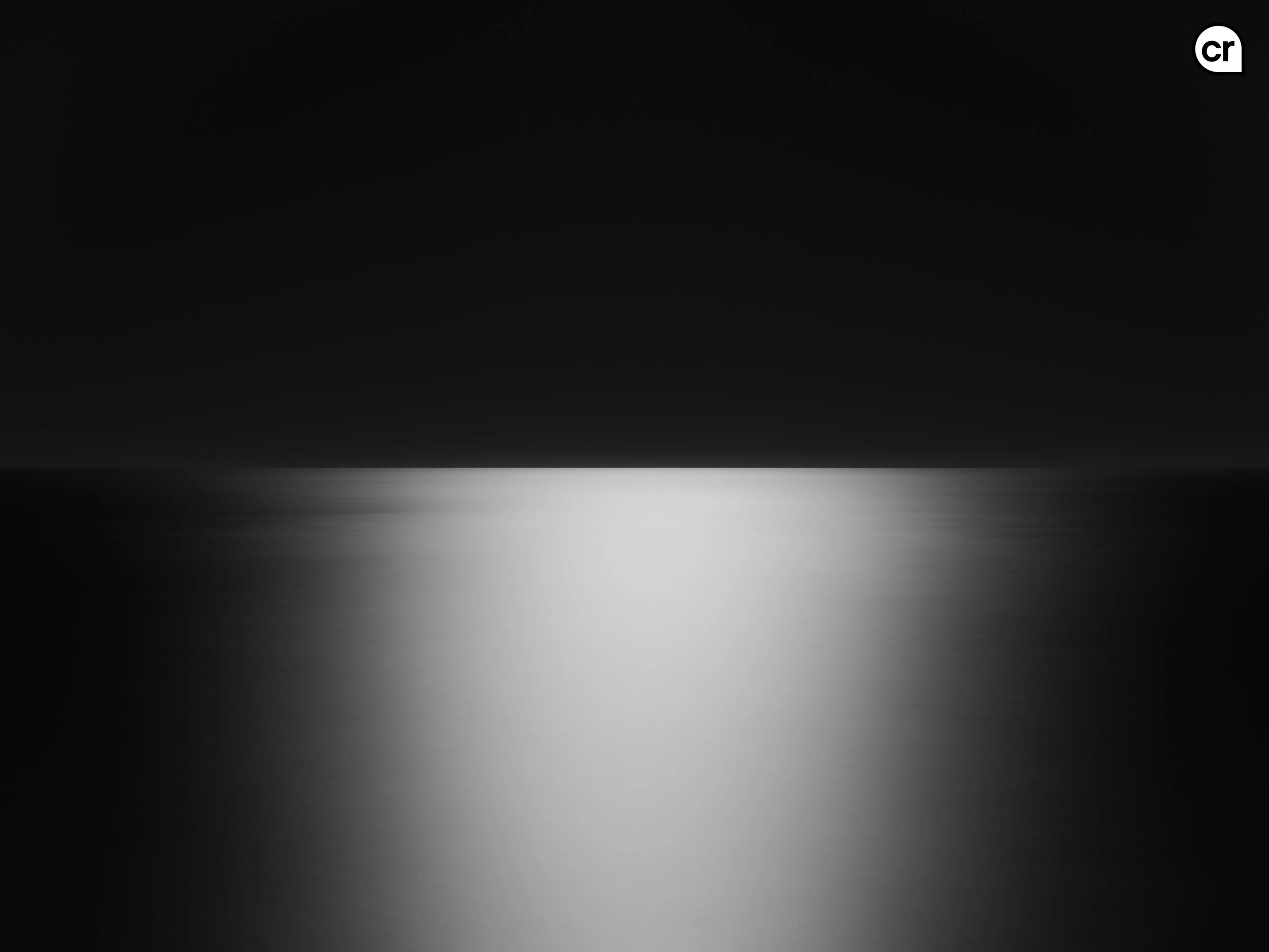 Black and white photograph of the moonlight on the Atlantic Ocean, Lisbon, Portugal. Made by Indigenous Design and Photography Ltd.