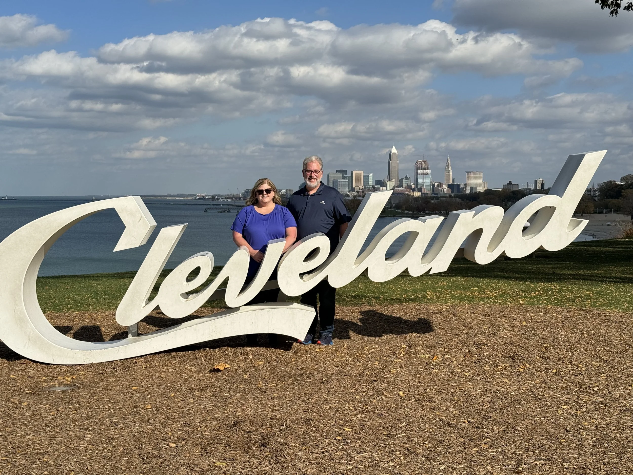 Sean and Cheryl Adkins at the Cleveland script sign overlooking downtown Cleveland, Ohio.