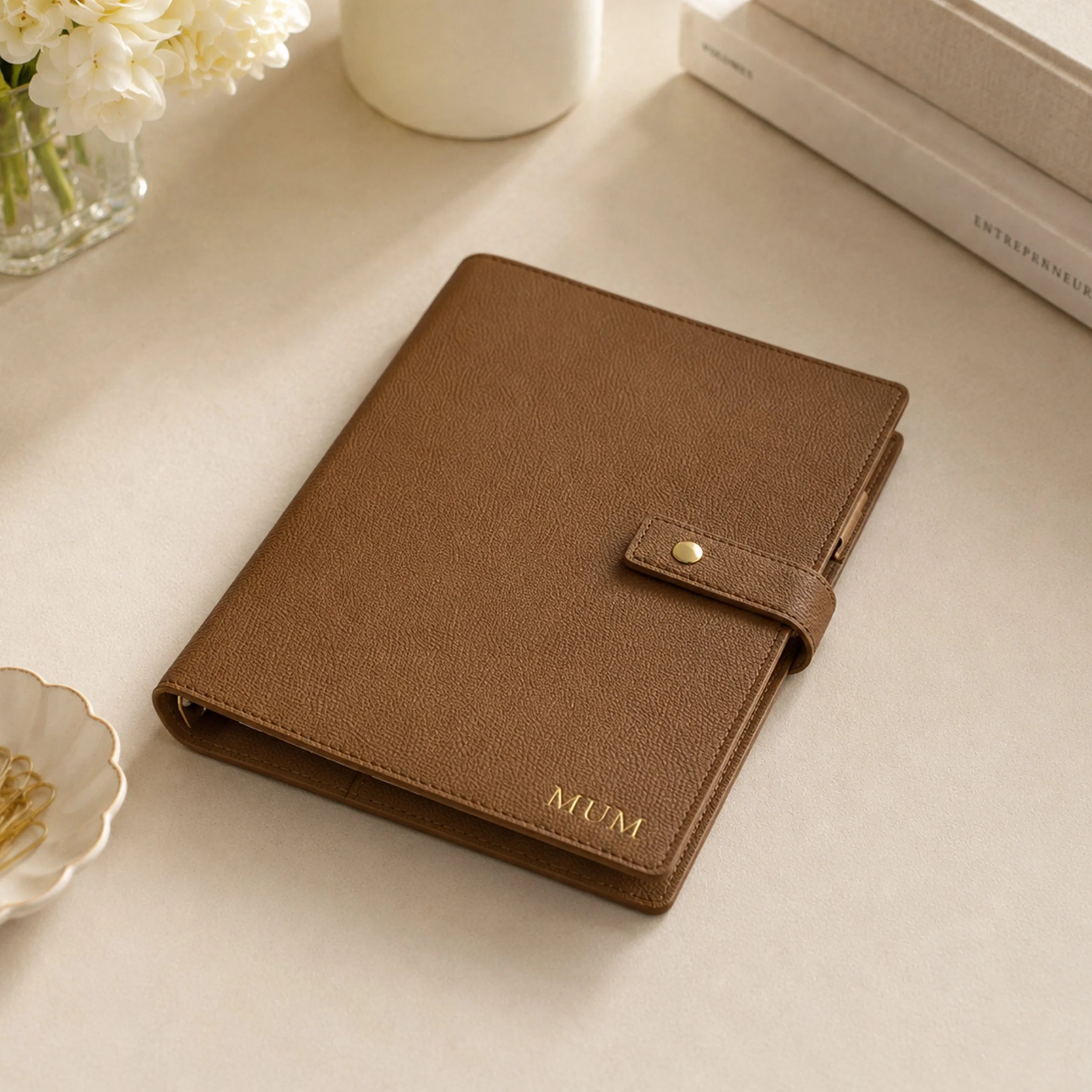 A brown A5 ring binder planner with gold foil lettering saying 'mum'.