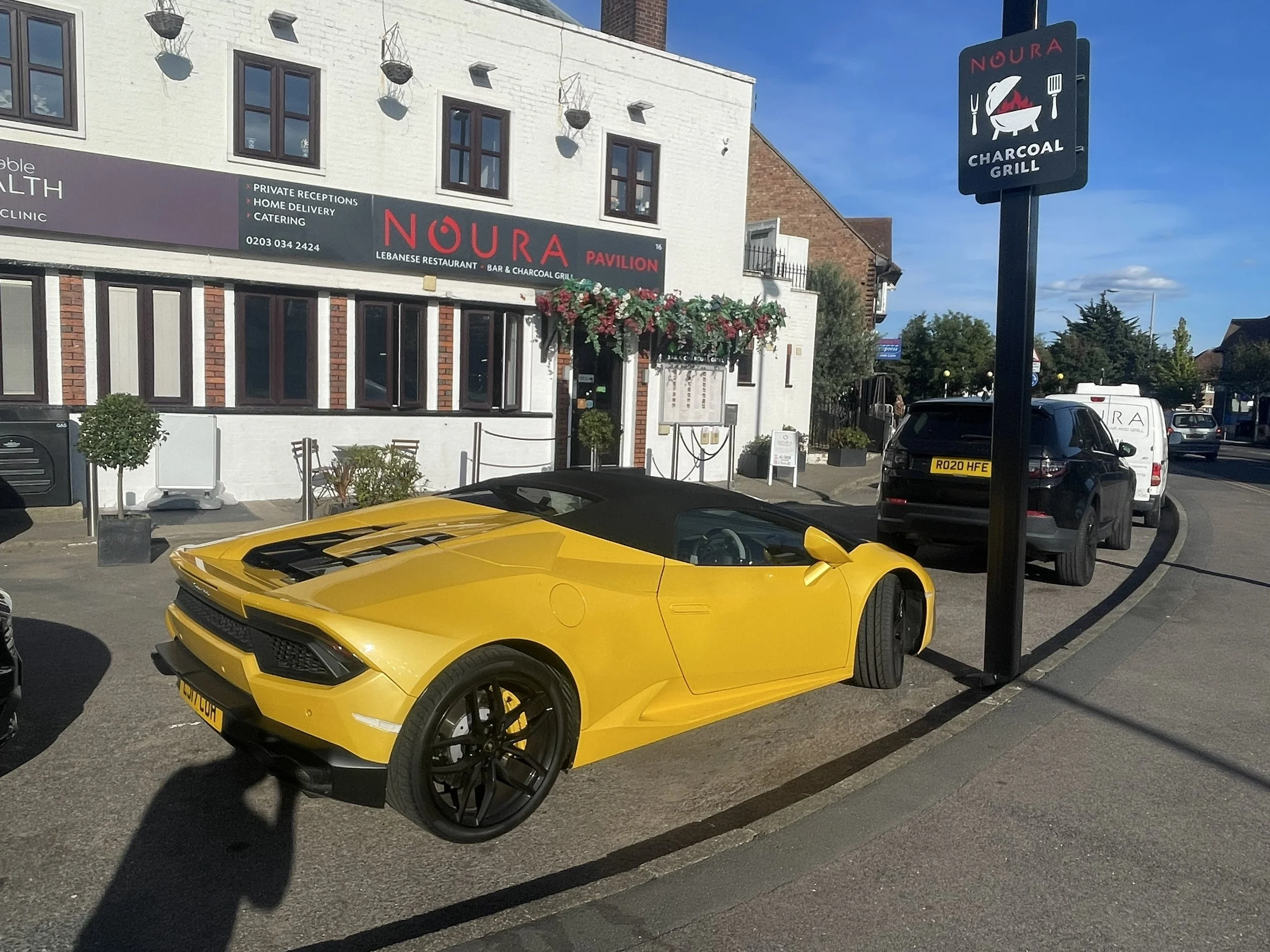 Outside Noura Kingston Lamborghini parked in front