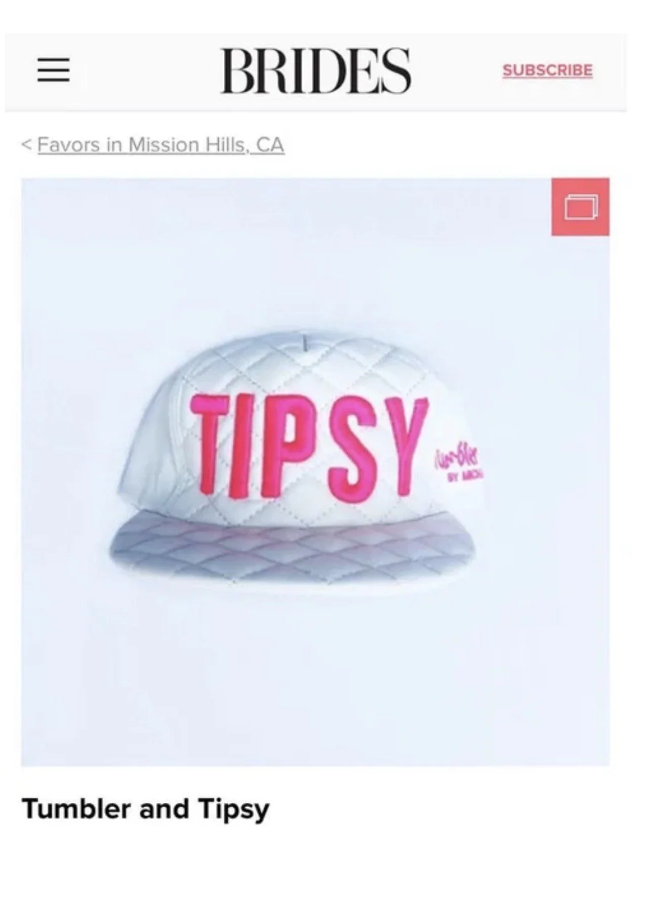 A white quilted baseball cap with bright pink embroidered text 'TIPSY' on the front, and smaller pink text 'Lush Life' by Lizzy on the side, photographed against a plain white background.