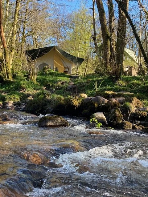 A safari tent on the river bank