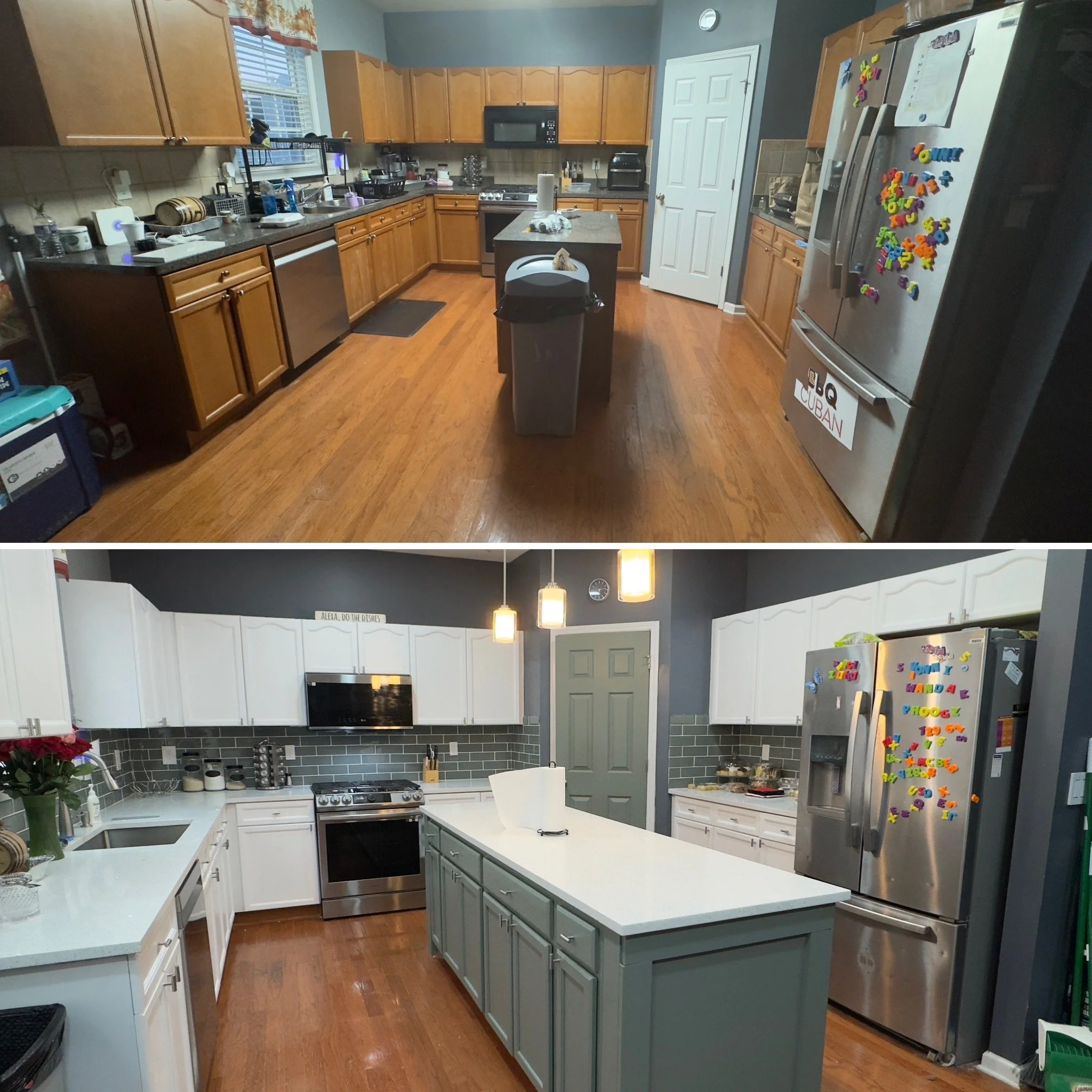 A kitchen with wooden cabinets, a gray island with a white countertop, stainless steel appliances including a refrigerator and oven, and various kitchen items on the counters. There is a window with a valance, and the floor is wooden.
