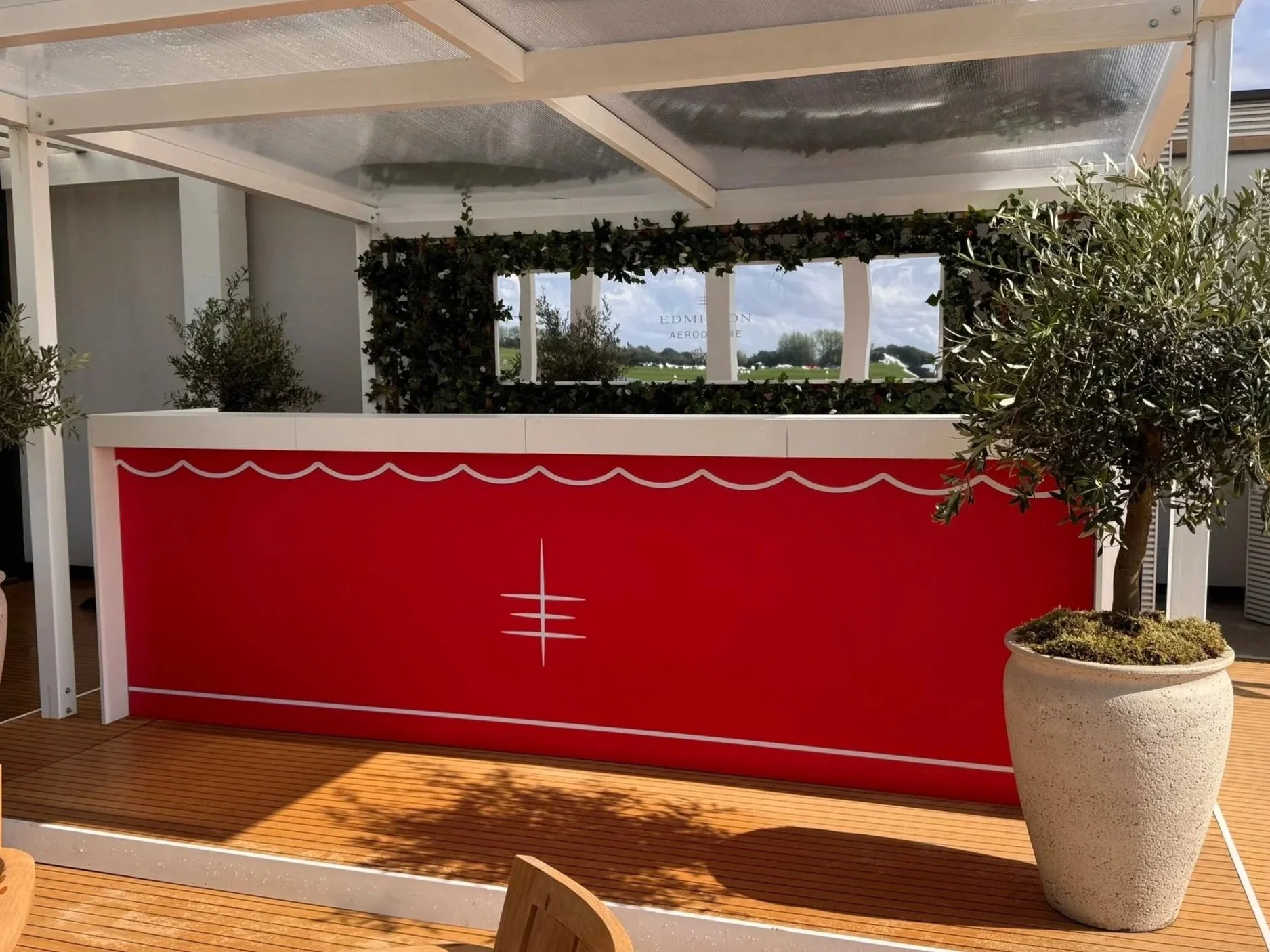 branded mobile bar hire, with decoration and potted olive trees